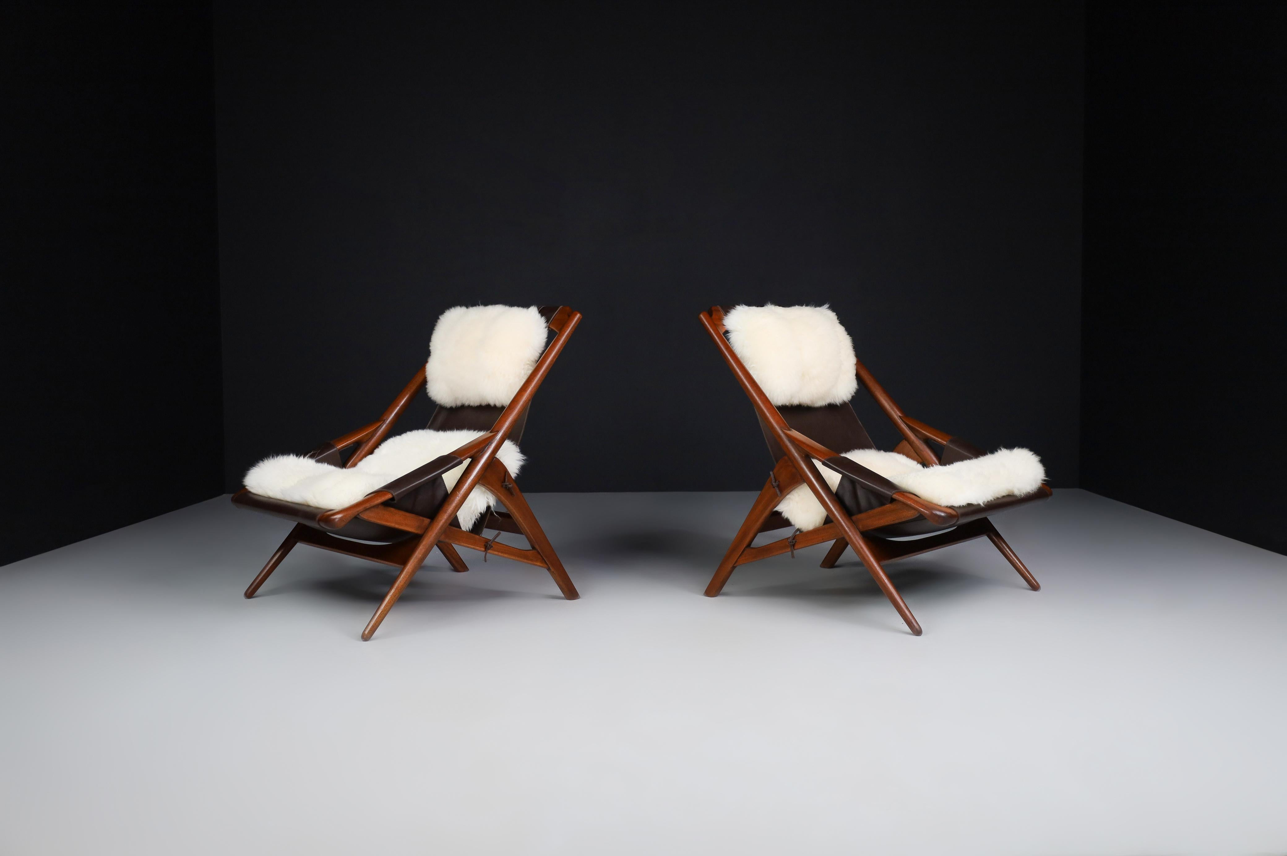 W.D. Andersag lounge chairs teak and leather, Italy 1959

Outstanding, fully restored pair of so-called 'hunting' lounge chairs created by W.D. Andersag and manufactured by Ideal Piacenza, Italy, 1959. This dynamic-shaped pair of lounge chairs