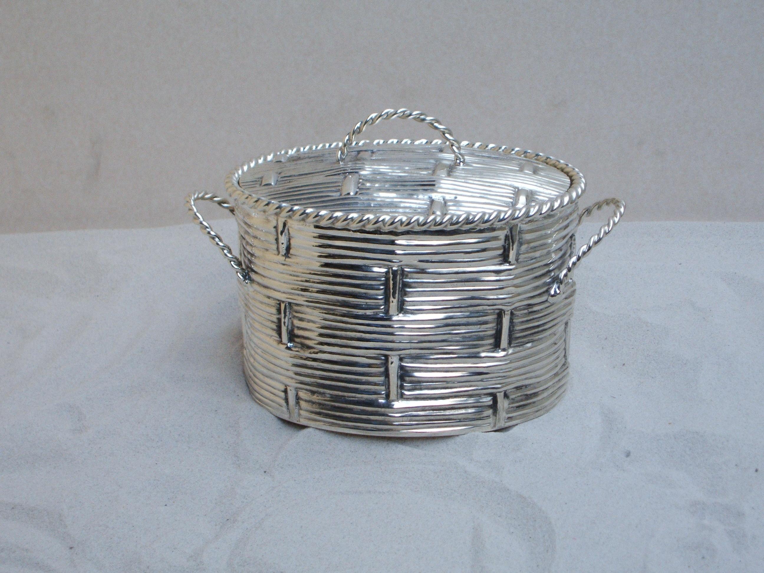 This weaded oval basket with lid was made by Maison Lapparra (silversmith in Paris since 1893). Silver Bronze
Created circa 1980s. This basket can also come as a pair. 
Measures: Height 13 cm 
Width 16 cm
Lenght 23 cm
Made in France.
