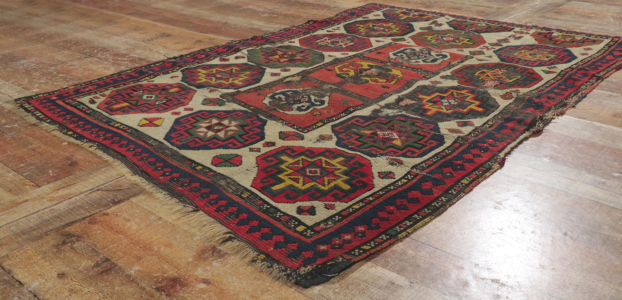 Wool Weathered Antique Caucasian Kazak Distressed Rug with Tribal Style For Sale