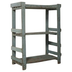 Weathered Blue Wooden Shelf with Open Framework
