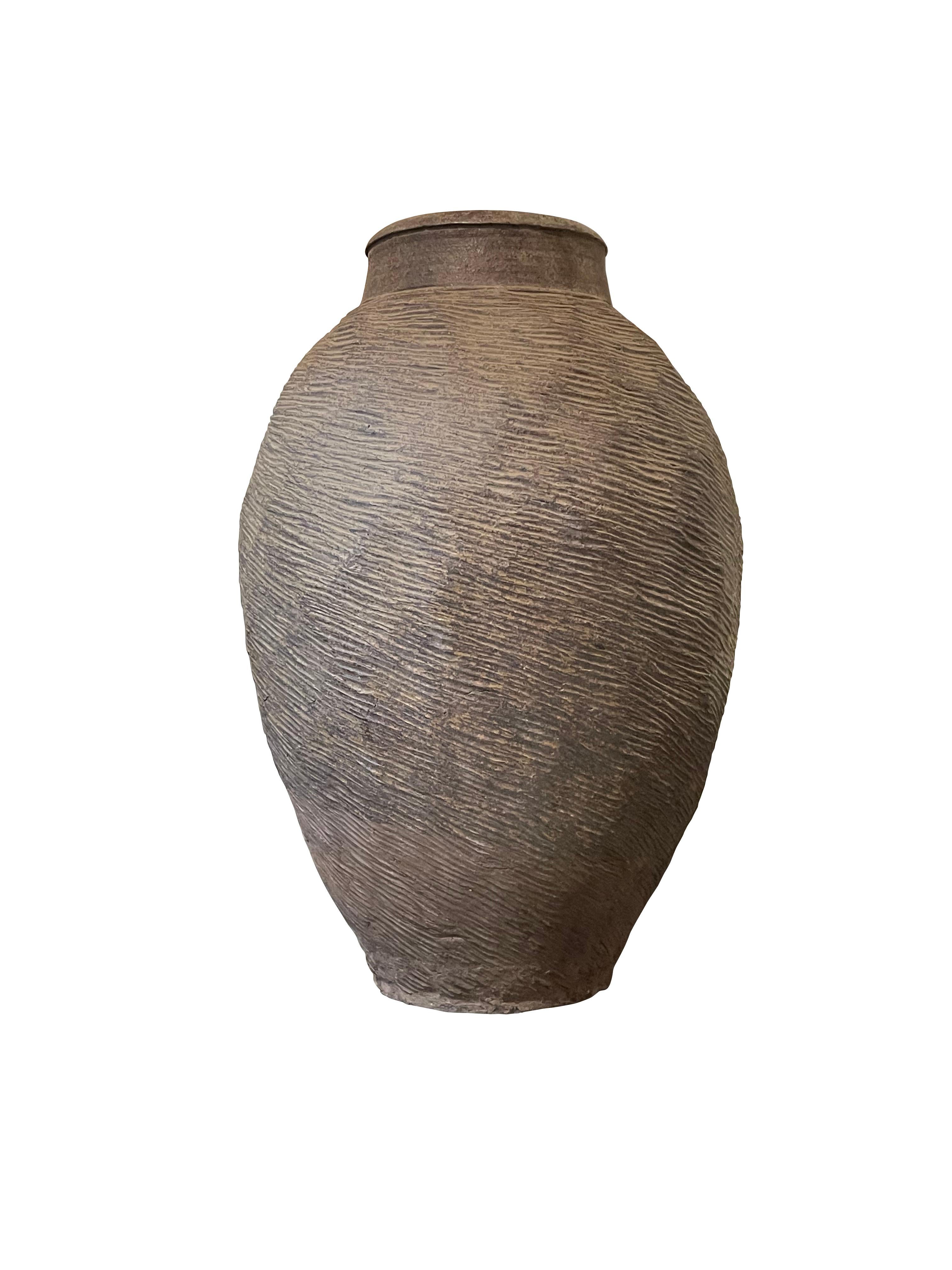 1940's Chinese horizontal raised rib textured vase.
Weathered brown color.