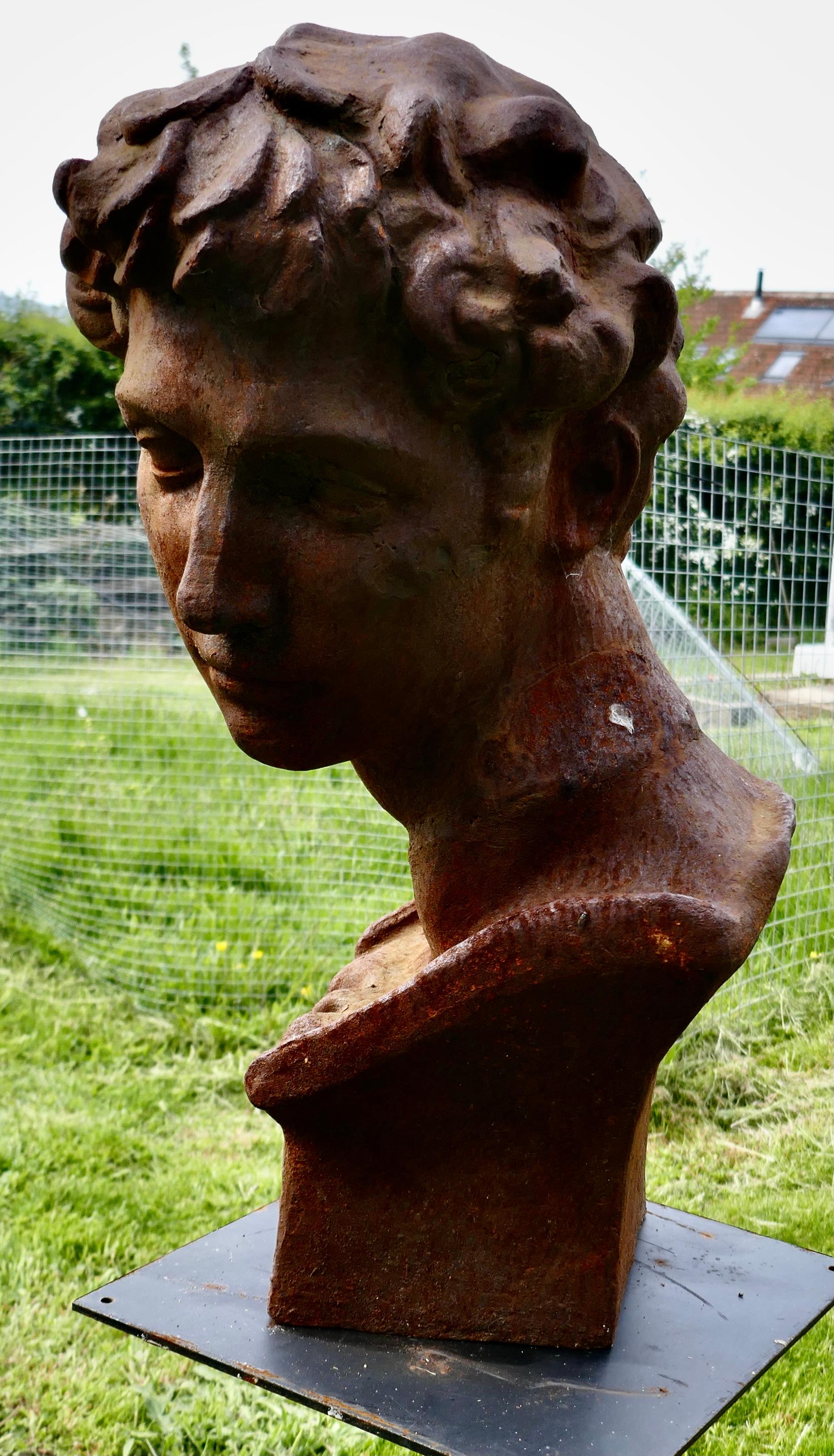  Weathered Cast Iron Statue of Michelangelo's David  

A lovely piece for the garden, celebrating “David”
The Bust is weather worn and has a rusty patina, it is otherwise in good condition 
The Bust is 24” high and approximately 12” in diameter
MS240
