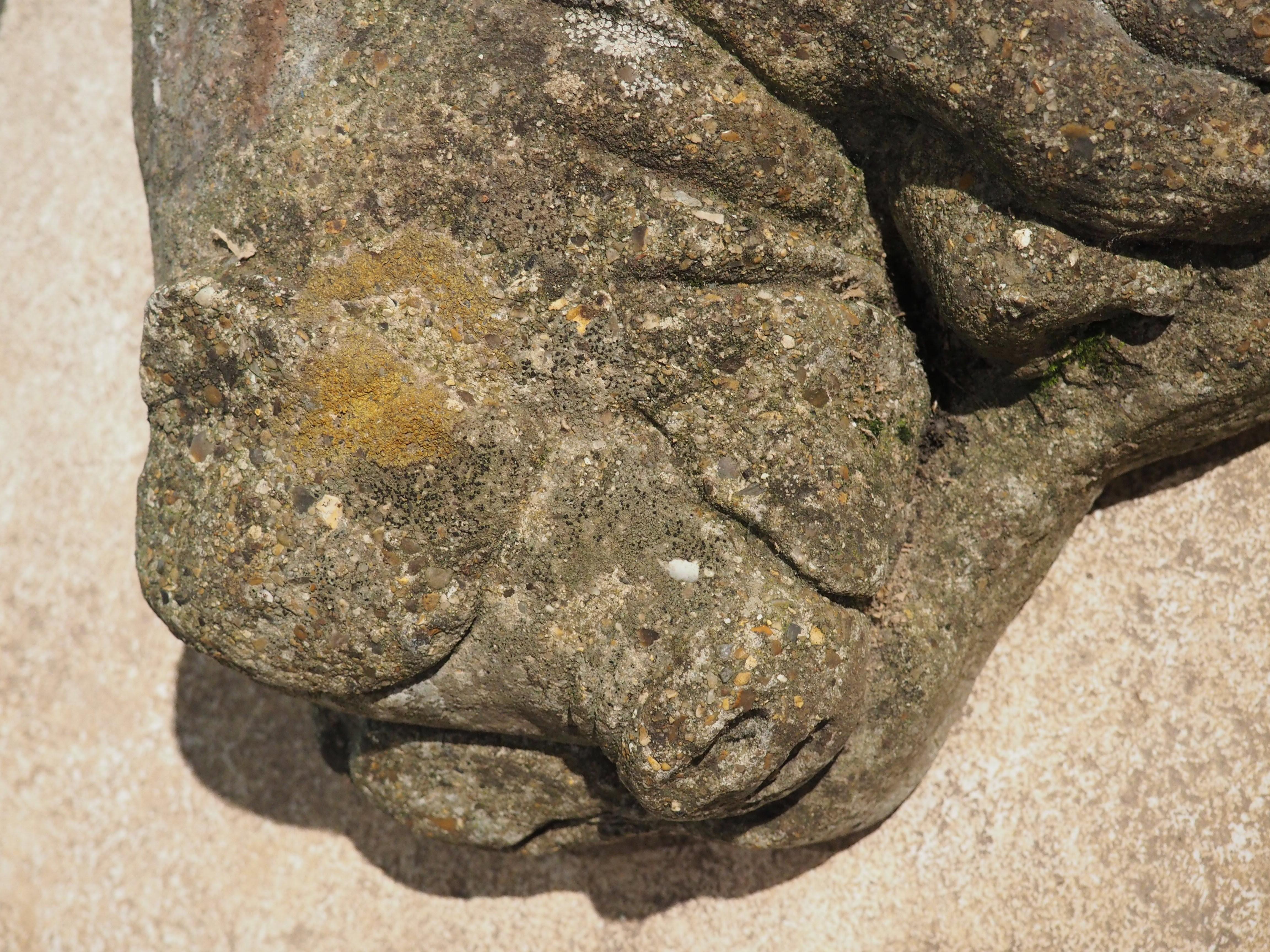 Cast in England in the 1900s using reconstituted stone, this charming pig and four piglets statue has developed a lovely weathered patina from exposure to the elements. Reconstituted stone is organic stone that has been crushed into small bits (if