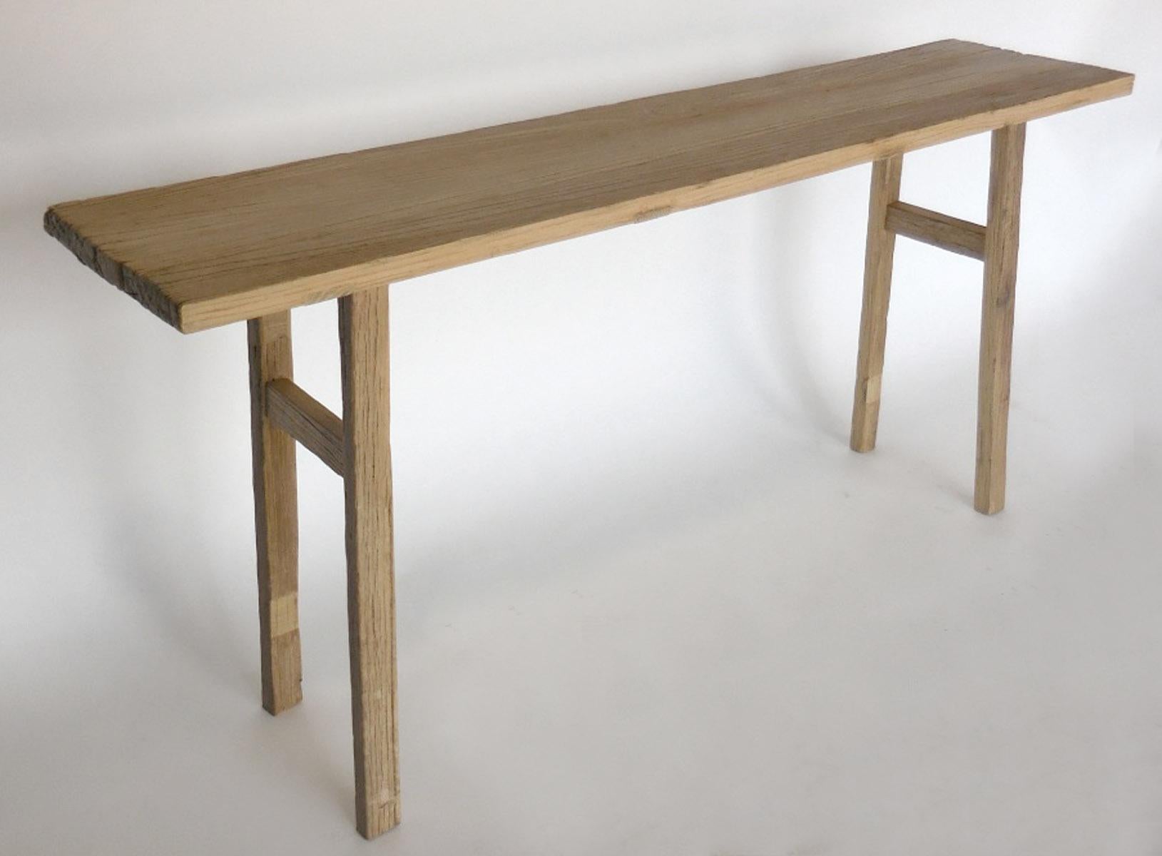 Naturally weathered two hundred year old Northern Elm from Japan fashioned into an airy low profile console table. Modern and rustic, made by Dos Gallos Studio. the patina is original, smooth and a grey beige.  
