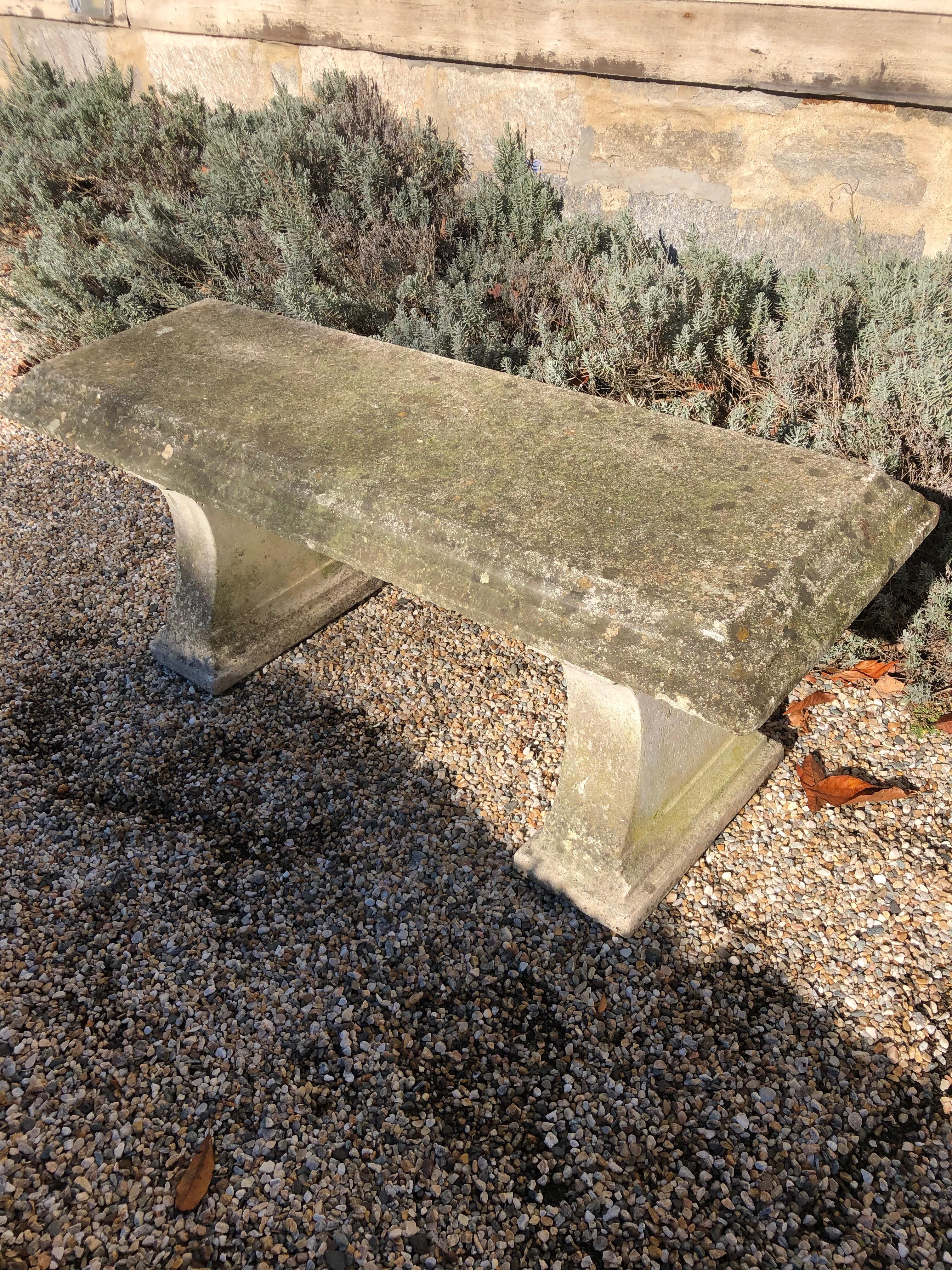This bench is a real beauty, both for its elegant tiered design on the edges of the top and supports, as well as its perfect patina. It is in excellent overall condition and can remain outside uncovered in all climates, but please install it on