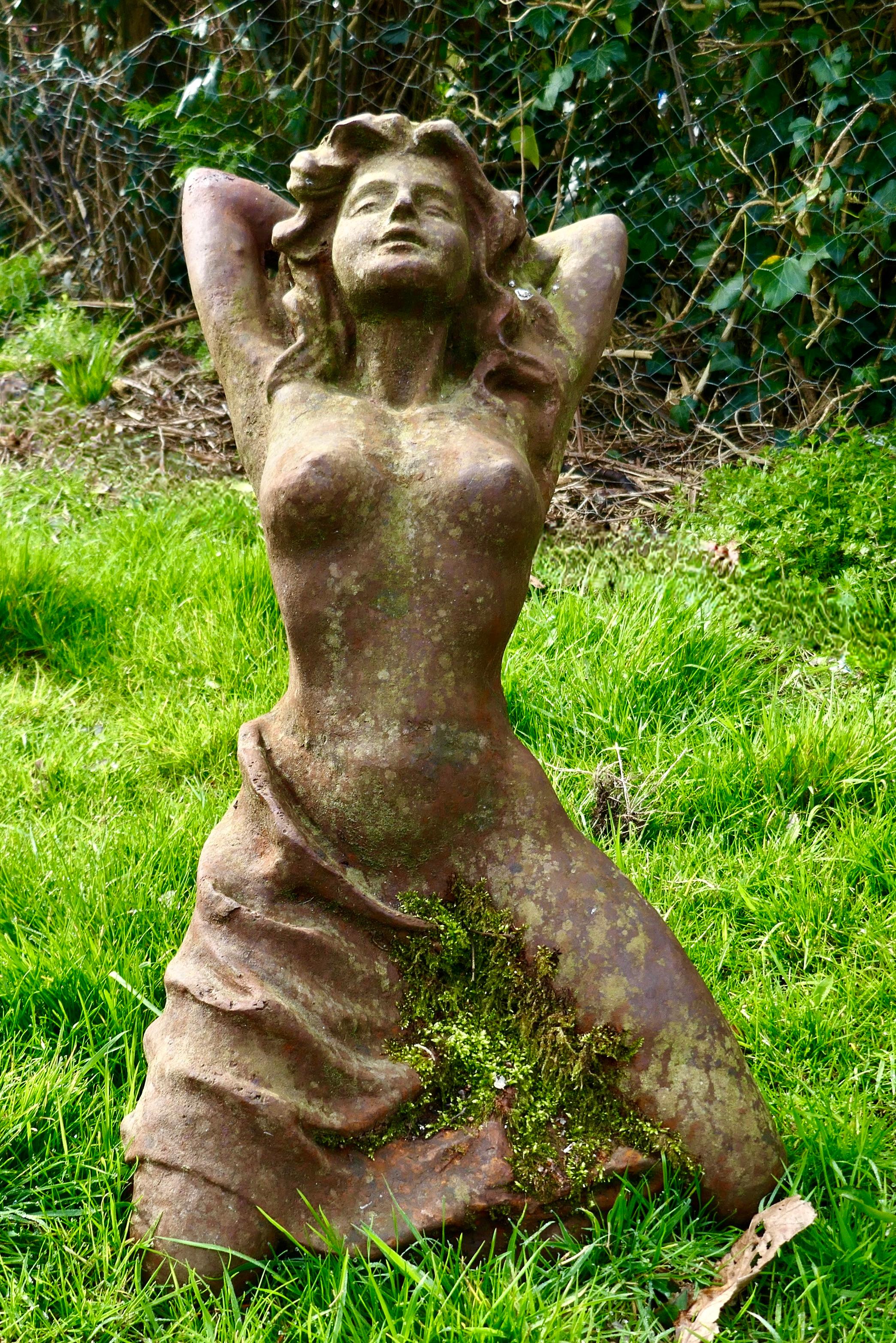 Weathered female statue of a nude figure “Shameless”

A pretty well known piece, this one is well weathered it is covered with moss lichen and rust
The Statue is 28” high 27” long and 20” wide
AC126.