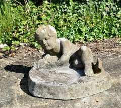 Weathered Garden Bird Bath with a Small Child