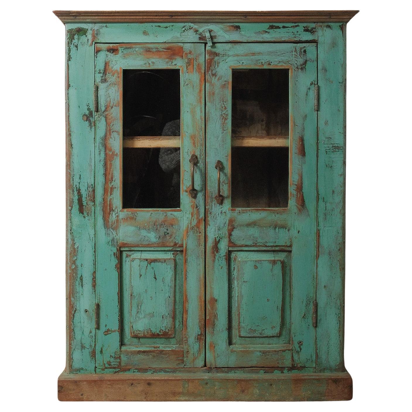 Weathered Green Painted Wood Cabinet with Glazed Doors and Brass Hardware