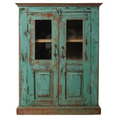 Weathered Green Painted Wood Cabinet with Glazed Doors and Brass Hardware