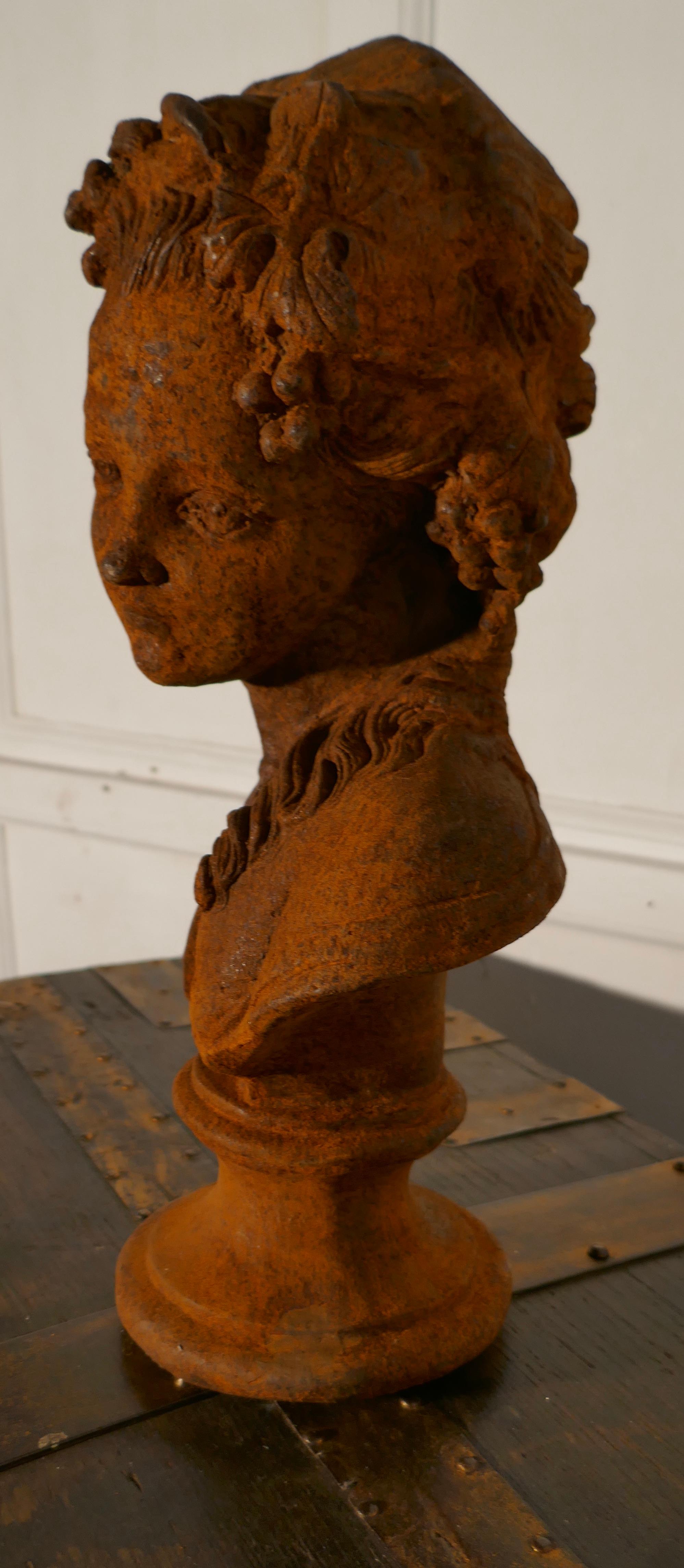 Weathered iron bust of a woman.

A charming piece, this bust is cast iron, and so very heavy, she has an expression of deep contemplation 
The stud is in good condition and very weathered
The figure is 17” tall and is 10” across
ND136.