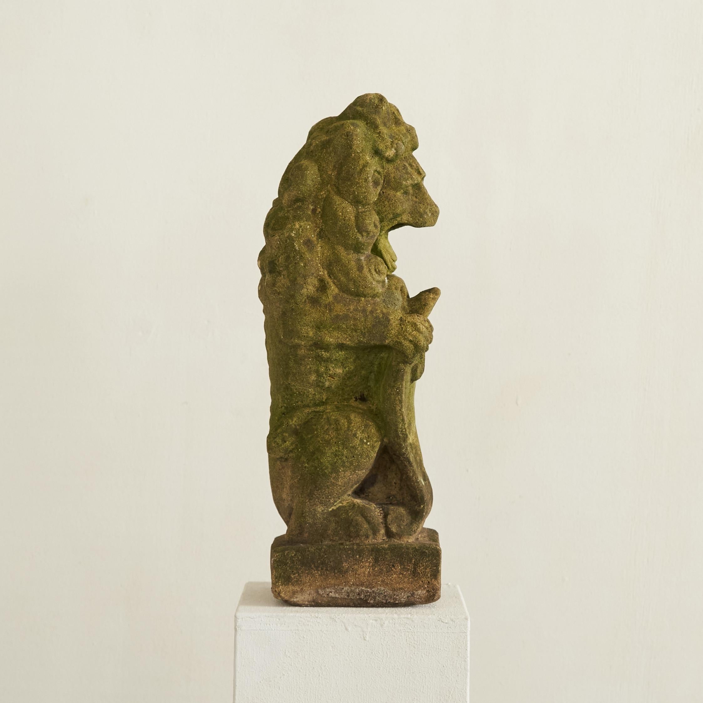 20th Century Weathered, Mossy and Patinated Cast Stone Lion with Shield Garden Statue 1930s For Sale