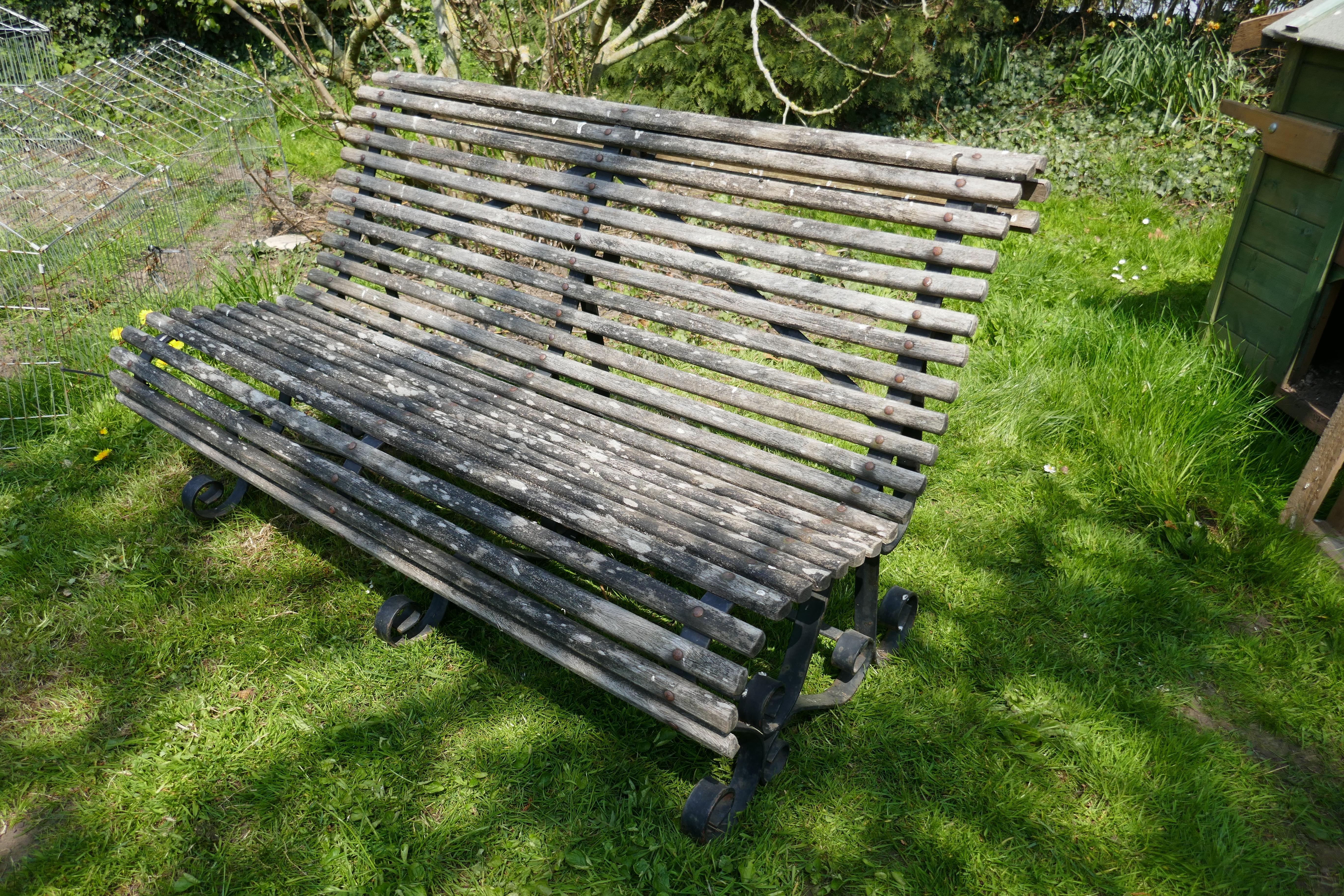 Weathered oak scroll steamer bench, lichen covered made by Atlas

Lovely design, scrolling over the back and front, Iron rivets stamped M Atlas
A very good quality piece, the oak has been bleached by the sun, the iron work has an exaggerated