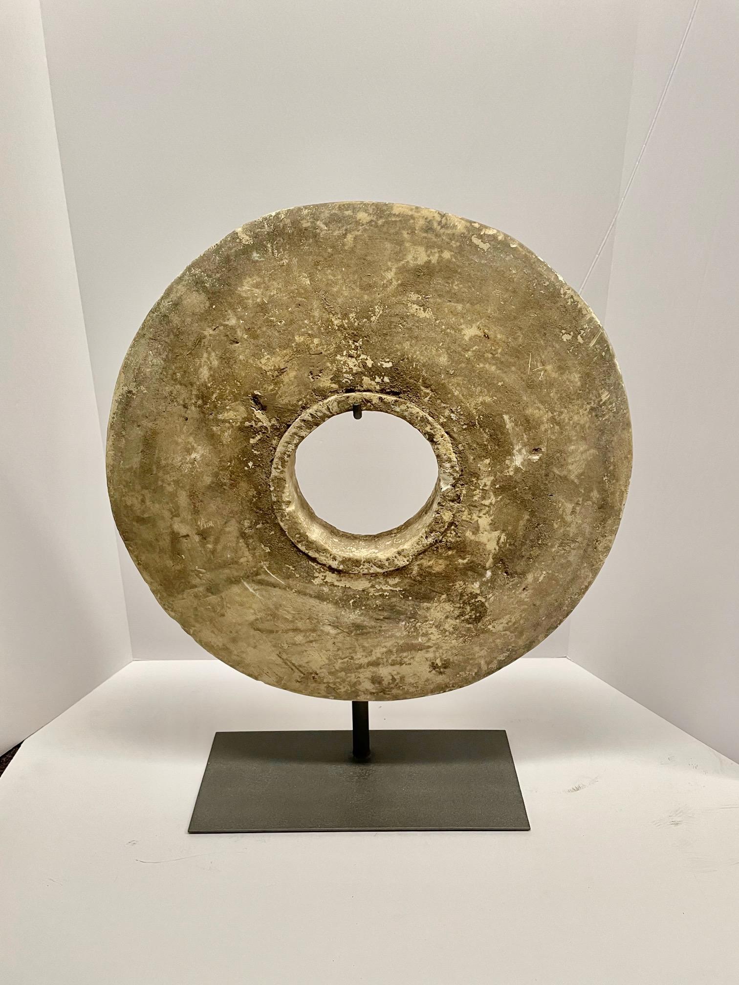 1920's Indonesian round stone architectural disc on stand.
Natural weathered patina.
Stand measures 4