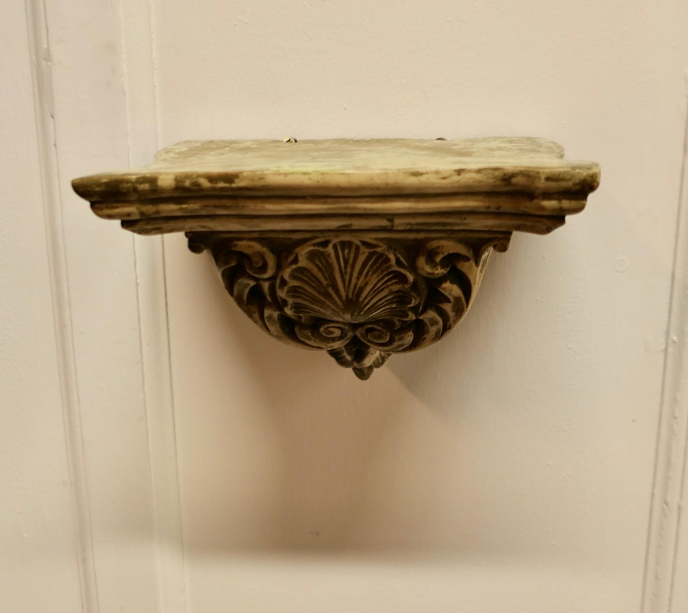 Plaster Weathered Wall Bracket, carved with Shell Decoration  This is a well weathered p For Sale