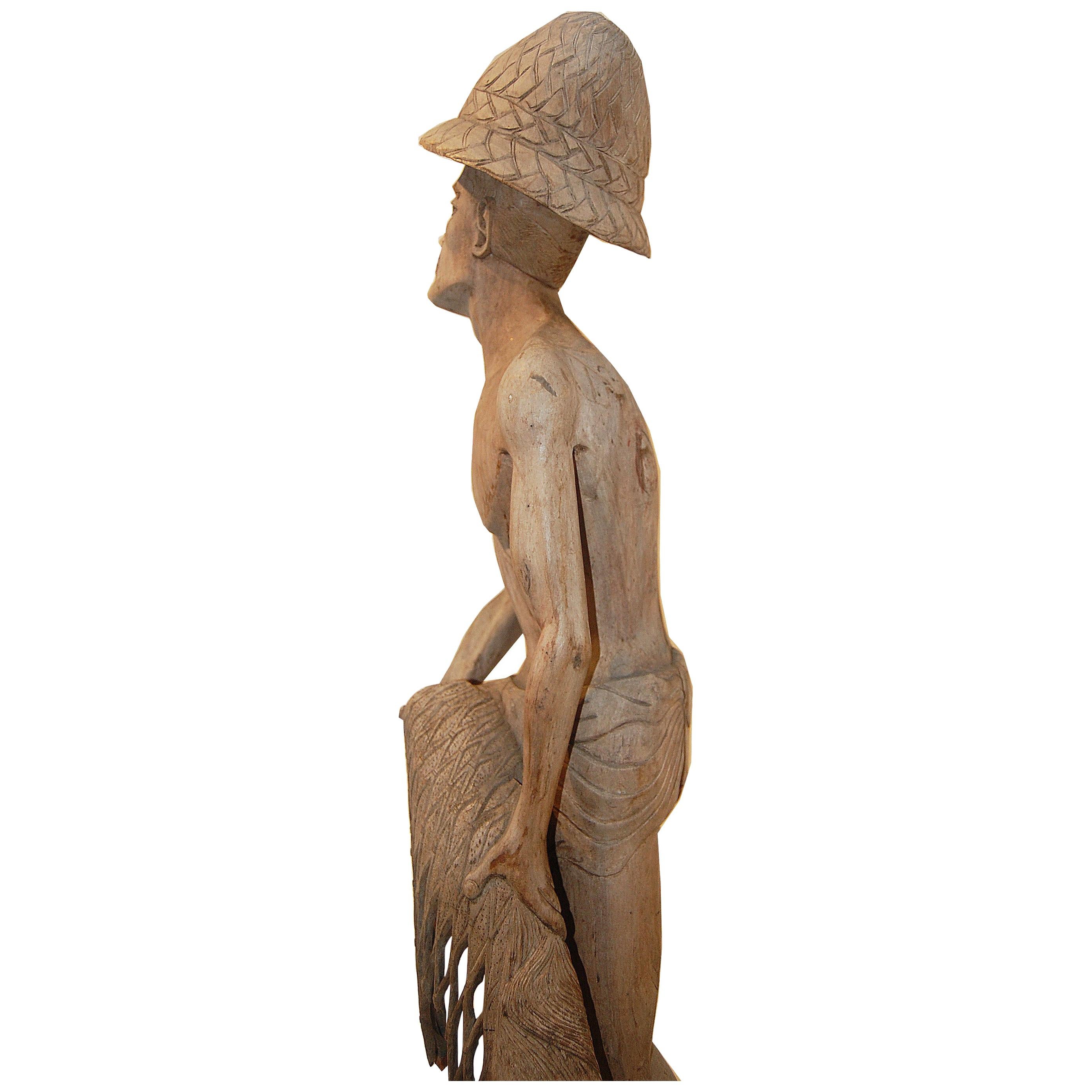 Weathered Wood Fisherman Sculpture For Sale