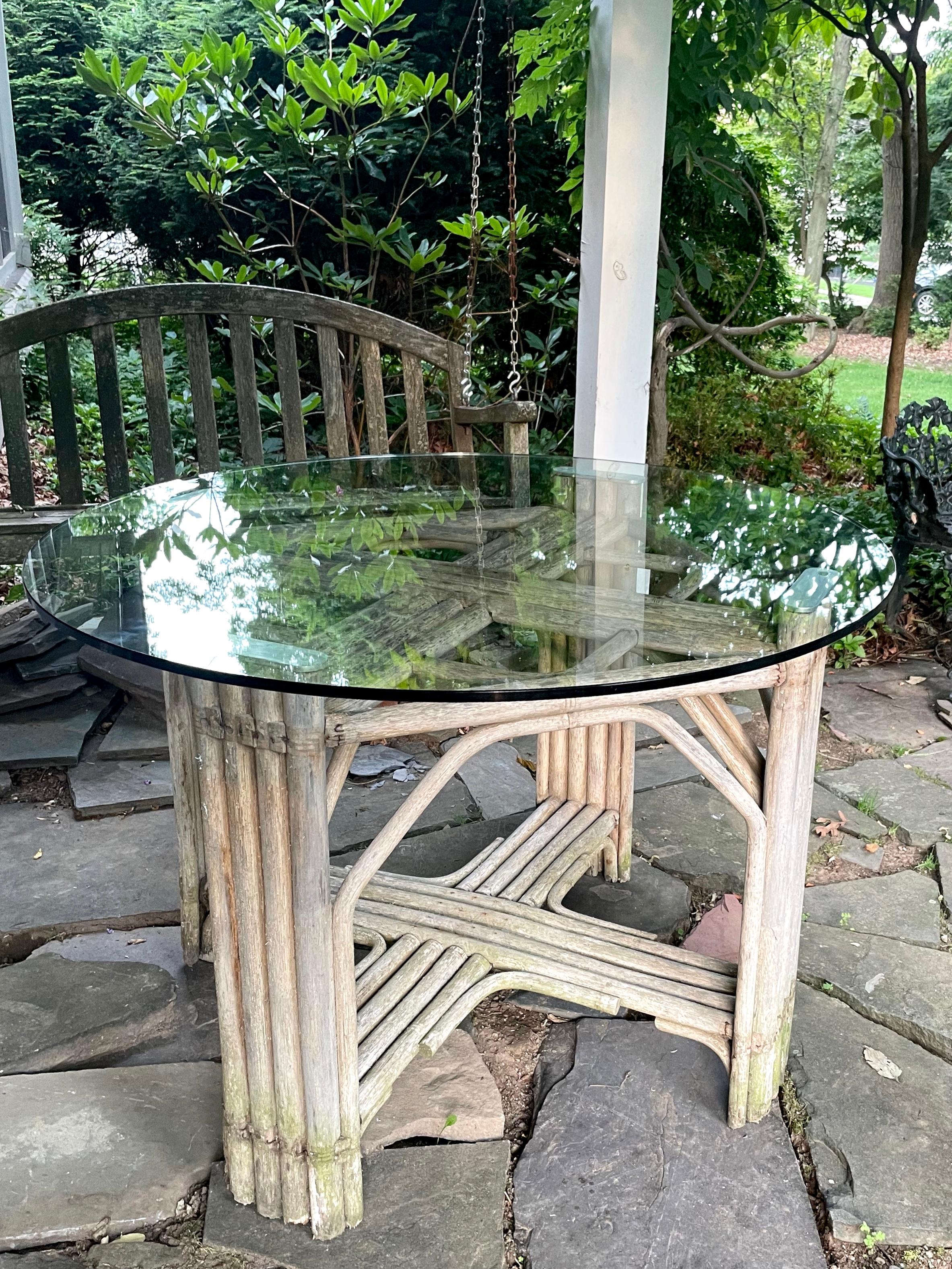 Weathered wood glass top dining table. Sturdy but weathered joined wood table with 42” round top with comfortable dining for four. United States, Mid-20th Century
Dimensions: 30” x 30