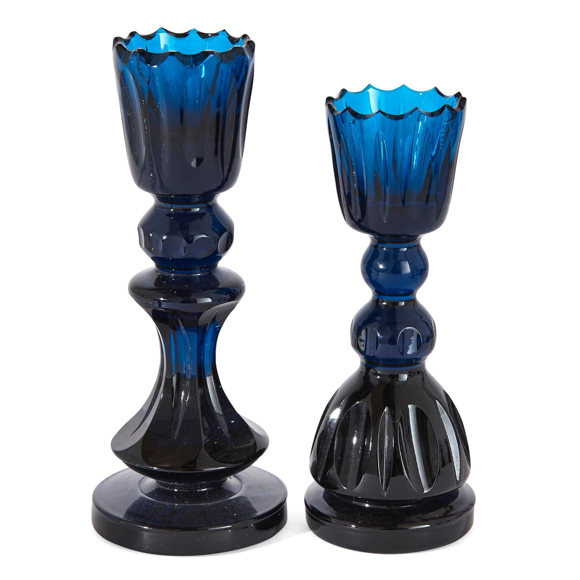 This set of chess pieces is formed from cut lead crystal, one side of blue crystal and the other of clear. The pieces (except the rooks) are raised on waisted socles above circular bases. Each piece is beautifully crafted by Webb Corbett at the time
