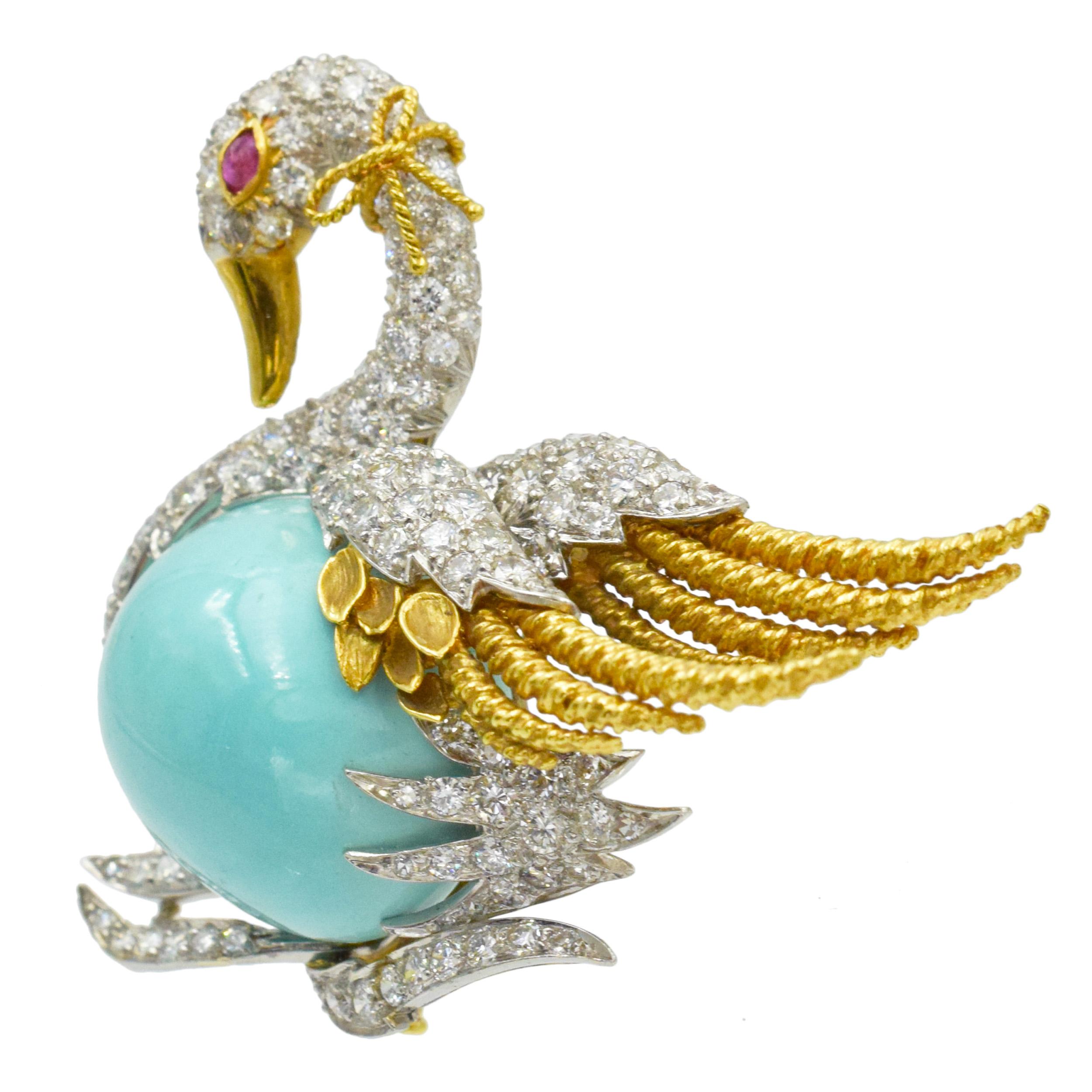 Webb Turquoise, diamond and ruby swan brooch in 18k yellow gold and platinum 
The brooch features a swan set with cabochon cut turquoise body, and round brilliant cut diamonds. Accented with marquise shape ruby eye and yellow gold feathers, beak and