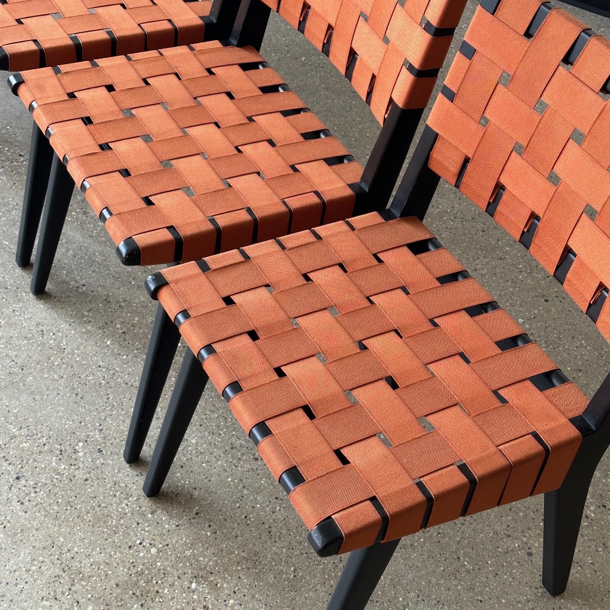 c. 2000s. Price is for the set. Contact us if you’d like to purchase a single item. Orange webbing on wood base. 

