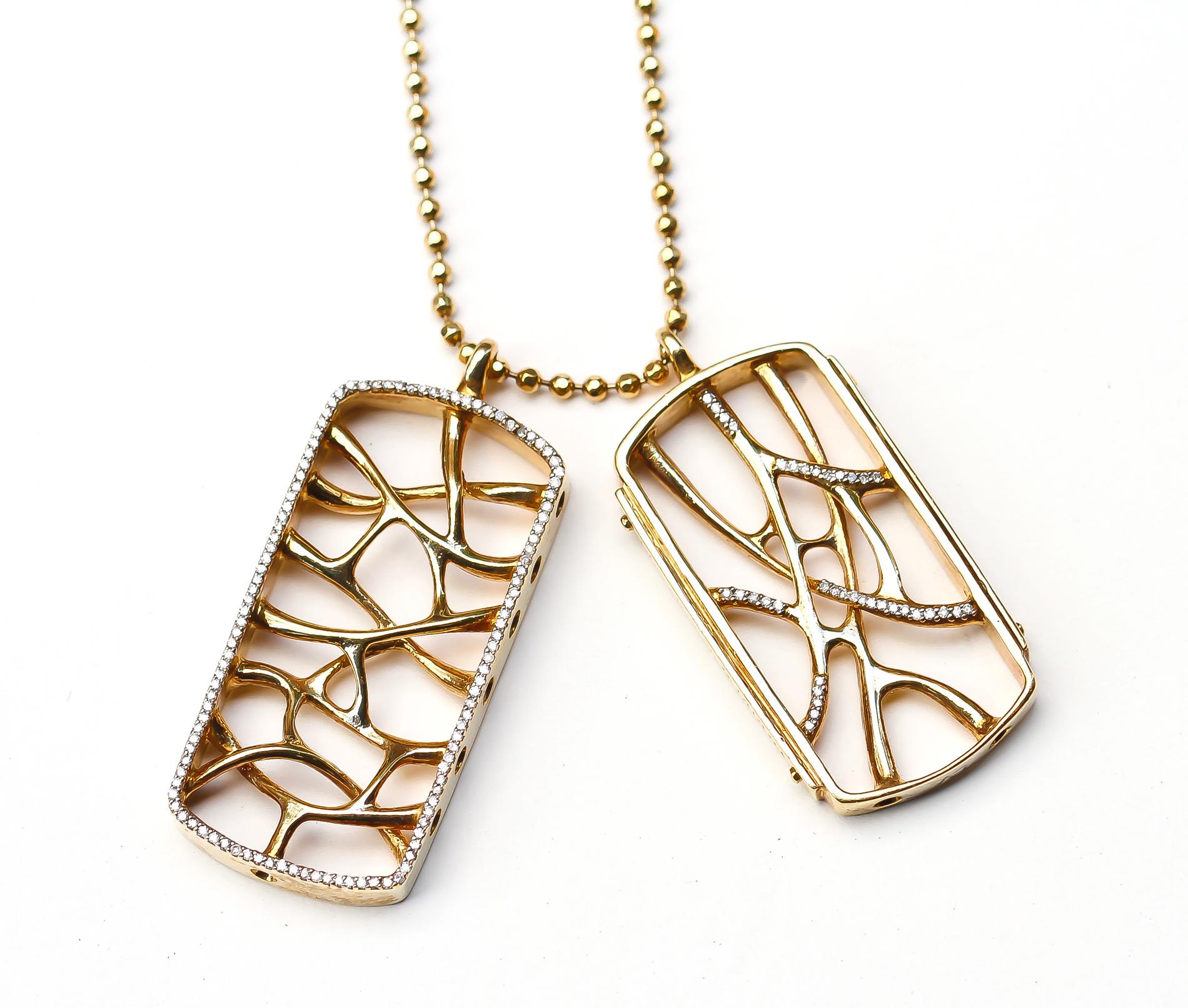 This 18K Gold Web Dog Tag Necklace is inspired by the fractal and natural root systems. This dog tag set is a limited edition series of ten by John Brevard. This intricately crafted, limited edition ring features morphogenic patterns and is part of