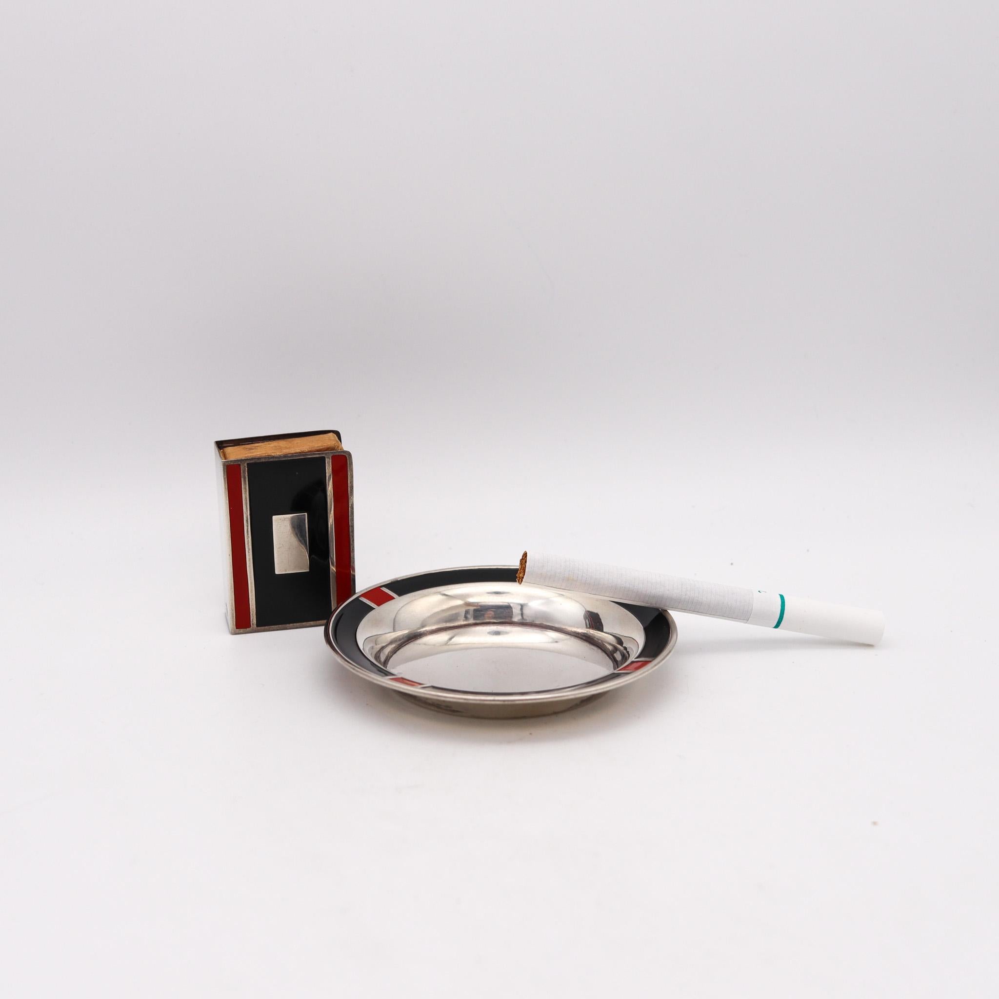 Rare smoking set designed by the E. G. Webster Company.

Very cool and beautiful smoking set, created in America during the art deco period, circa 1925. This colorful set is composed by a round dish and a match box holder. It was carefully crafted
