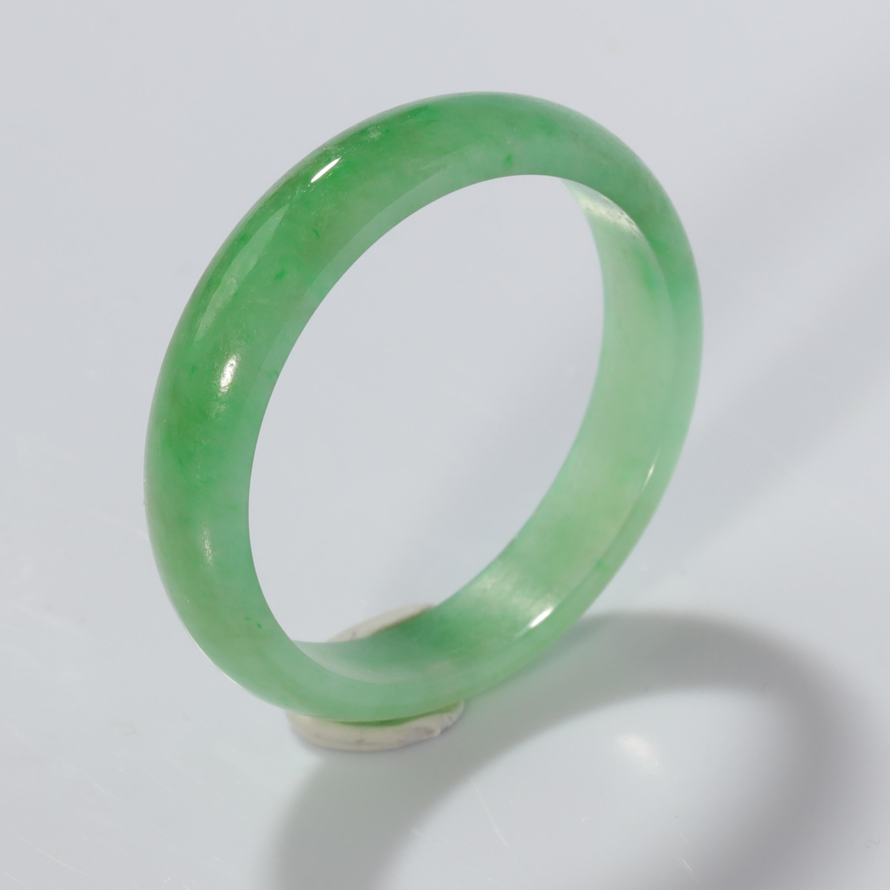 A pristine, never worn band of finely colored and translucent green makes for a most strikingly unique, beautiful, and durable wedding band. Or un-wedding band. Or stack ring. Or just the ring you buy yourself because you require a bump of