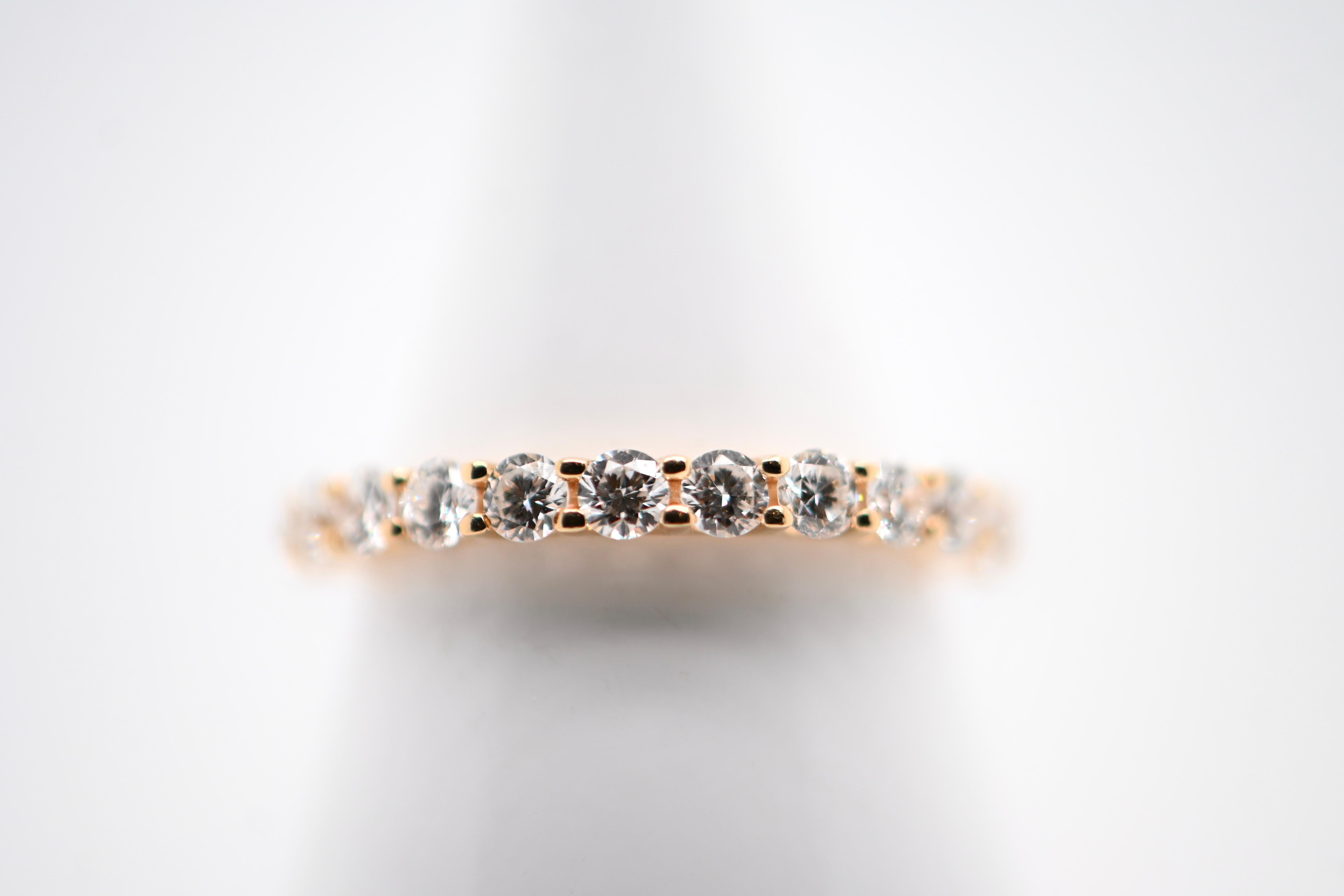 Indulge in timeless elegance with our Half-Eternity Wedding Band, meticulously crafted from 18 carat yellow gold. This exquisite piece features twelve brilliant-cut diamonds, totaling 0.870 carats and boasting a stunning F color grade, ensuring