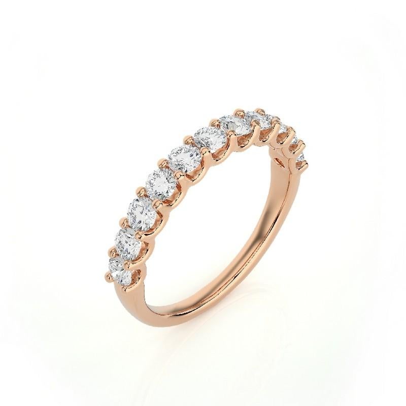 Diamond Total Carat Weight: This elegant 1981 Classic Collection wedding band ring features a total carat weight of 0.9 carats, showcasing 11 brilliant round diamonds that radiate exquisite sparkle and sophistication.

Gold Purity: Crafted with
