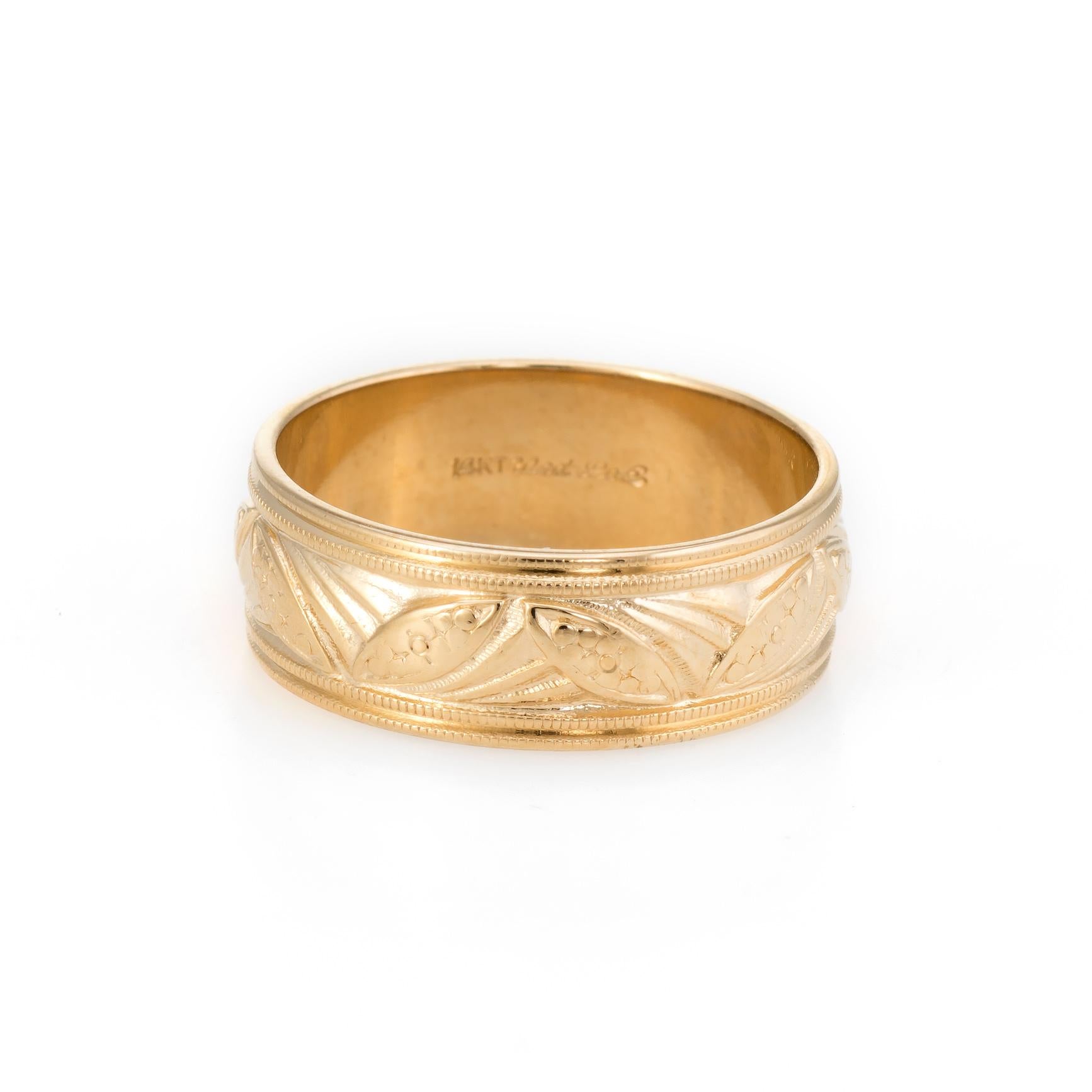 Elegant vintage wedding band, crafted in 14 karat yellow gold. 

The band features fine mille grain and navette embossed detail that is continuous around the band.   

The ring is in excellent condition. 

Particulars:

Weight: 4.1 grams

Stones: 