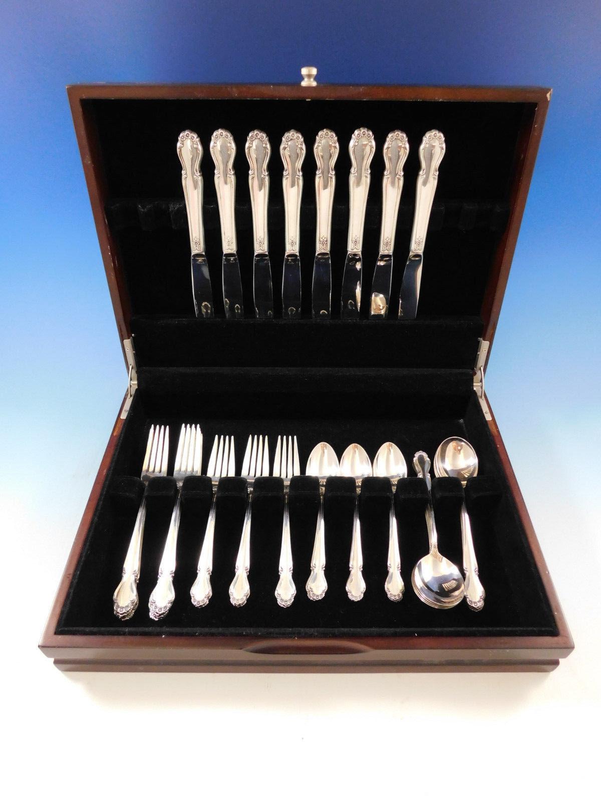 Exquisite wedding bells by International sterling silver flatware set - 40 pieces. This set includes:

Eight knives, 9