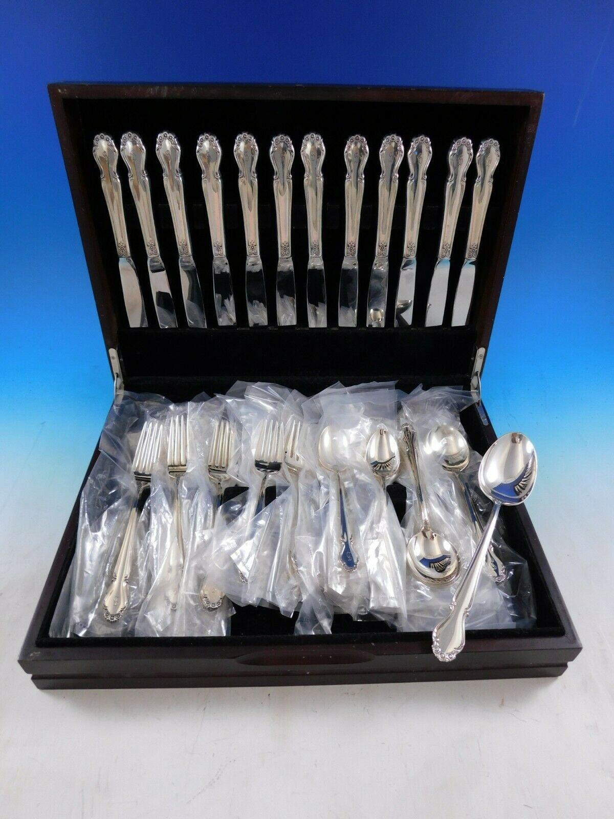 Wedding bells by International Sterling Silver flatware set - 61 pieces. This set includes:

12 Knives, 9