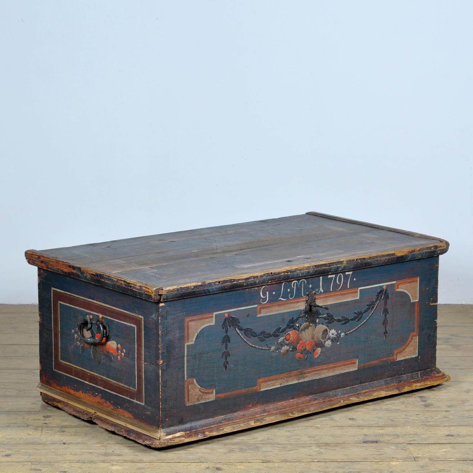A pine wedding chest from Central Europe, probably German, dated 1797. The Neoclassical style persisted in Europe until after the 1820s. This color scheme of terracotta red and earthy blue is typical of the style and is often seen in Swedish and