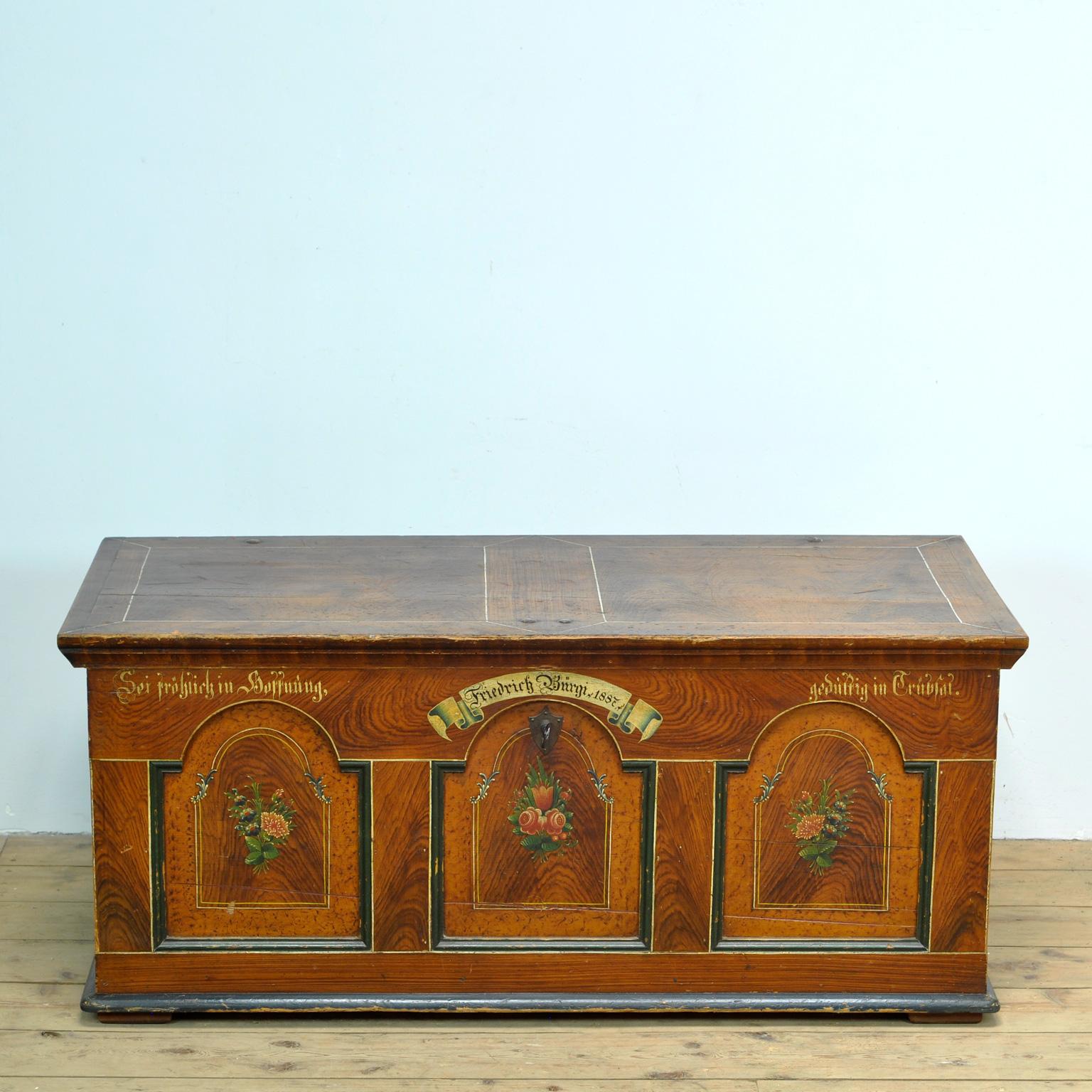 German dowry box made for one Friedrich Burgi in 1887. Hand painted with beautiful fine details. The iron details such as the handles and hinges are forged by hand. The box is made of pine. There is a compartment on the inside for valuables.