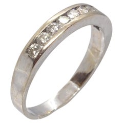 Wedding ring, 18 kt white gold and diamonds, 0.25 cts in total