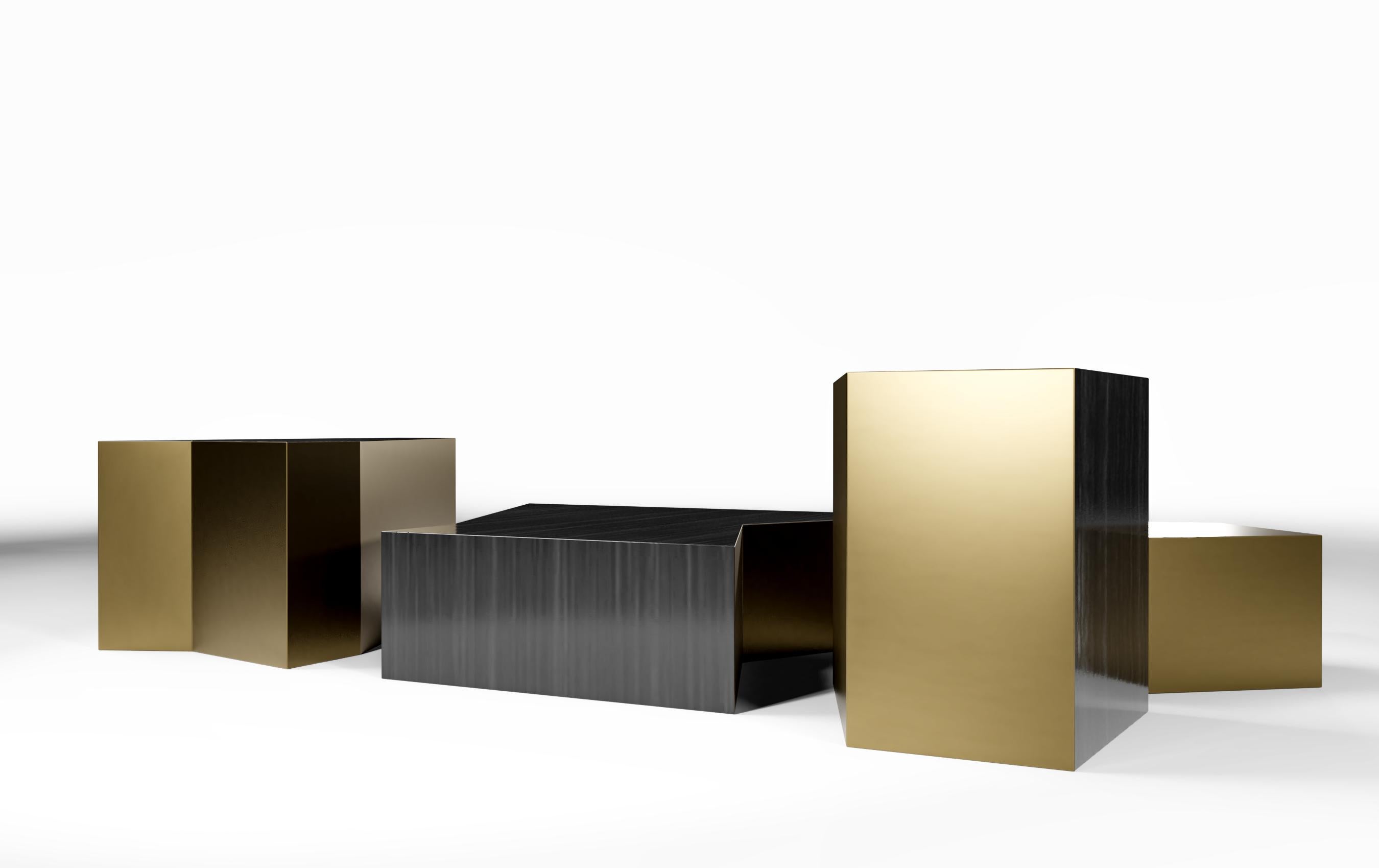 With 4 unique sculptural pieces of varying sizes, finishes and elevations, the wedge coffee table pieces are independent, but blend harmoniously together. The coffee table has a body of smoked eucalyptus high gloss wood finish with sides of