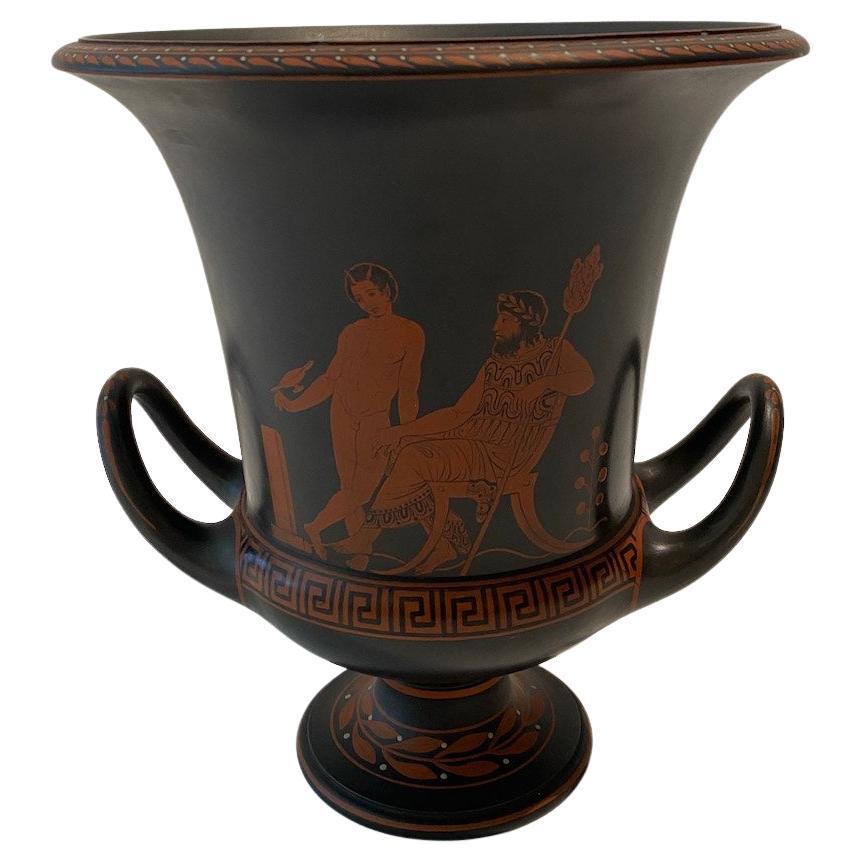 Wedgewood encaustic painted , matte finished black basalt stone urn.  Hand painted decoration with 2 scenes.  Egyptian Revival style.  Circa 1790-1820.