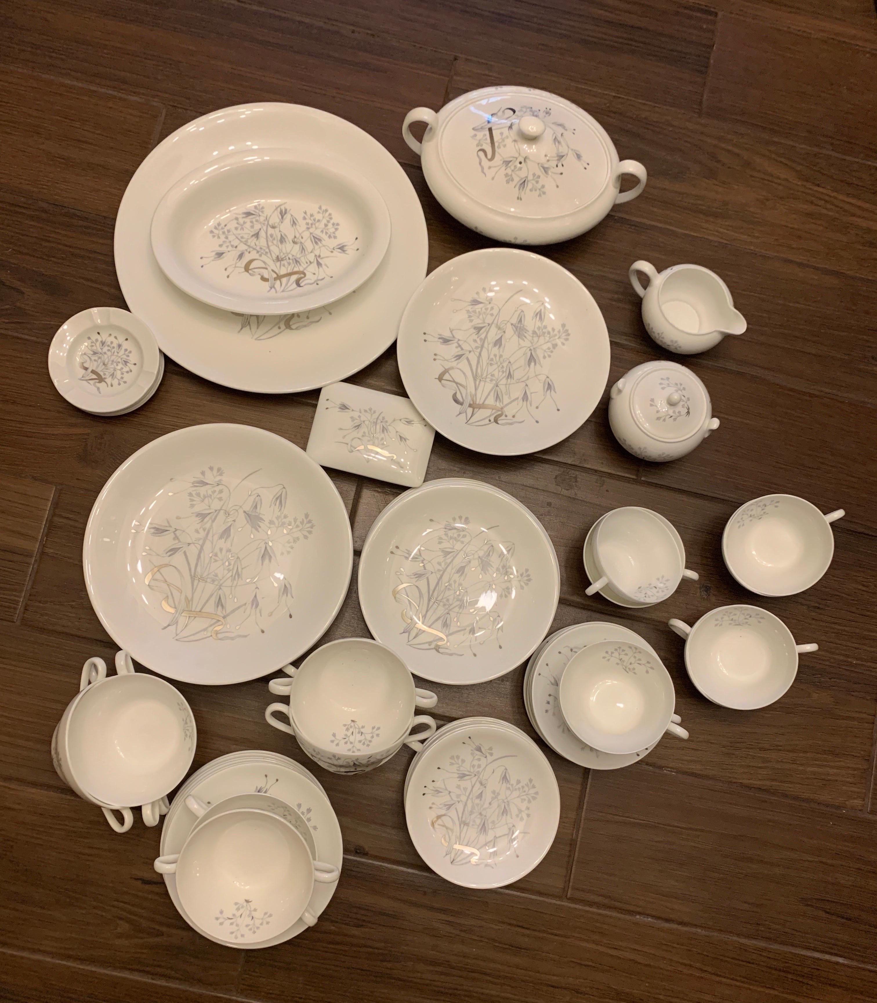 Just in time for the Holidays! Have a jaw dropping table top with this British 1960s set. This vintage beautiful bone china set made by Wedgewood in England came from a multi million dollar Palm Springs Estate. The pattern is grey English flowers