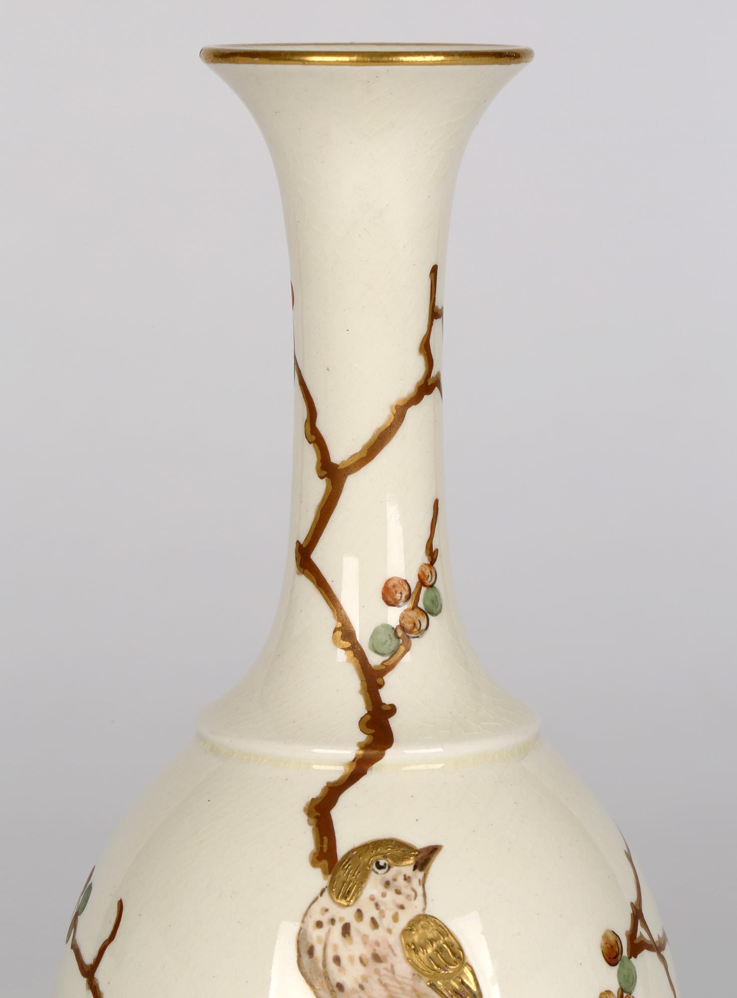 A very fine and rare Aesthetic Movement vase hand painted with bird perched amidst foliage in the Japonesque taste by Wedgwood and dating from around 1875. This finely made ceramic vase is of bottle shape with a bulbous oval shaped body and tall