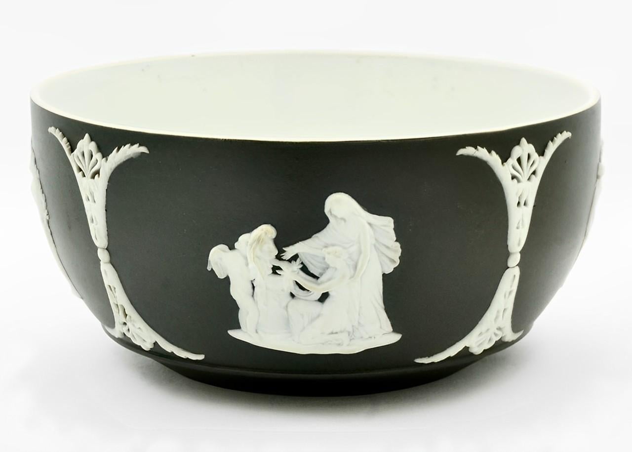 Wonderful Wedgwood antique Victorian black jasperware bute bowl. Featuring an ornate design with classical relief figures. Measuring inside diameter 12.7 cm / 5 inches and height 6.35 cm / 2.5 inches. The bowl is in very good condition for its age,