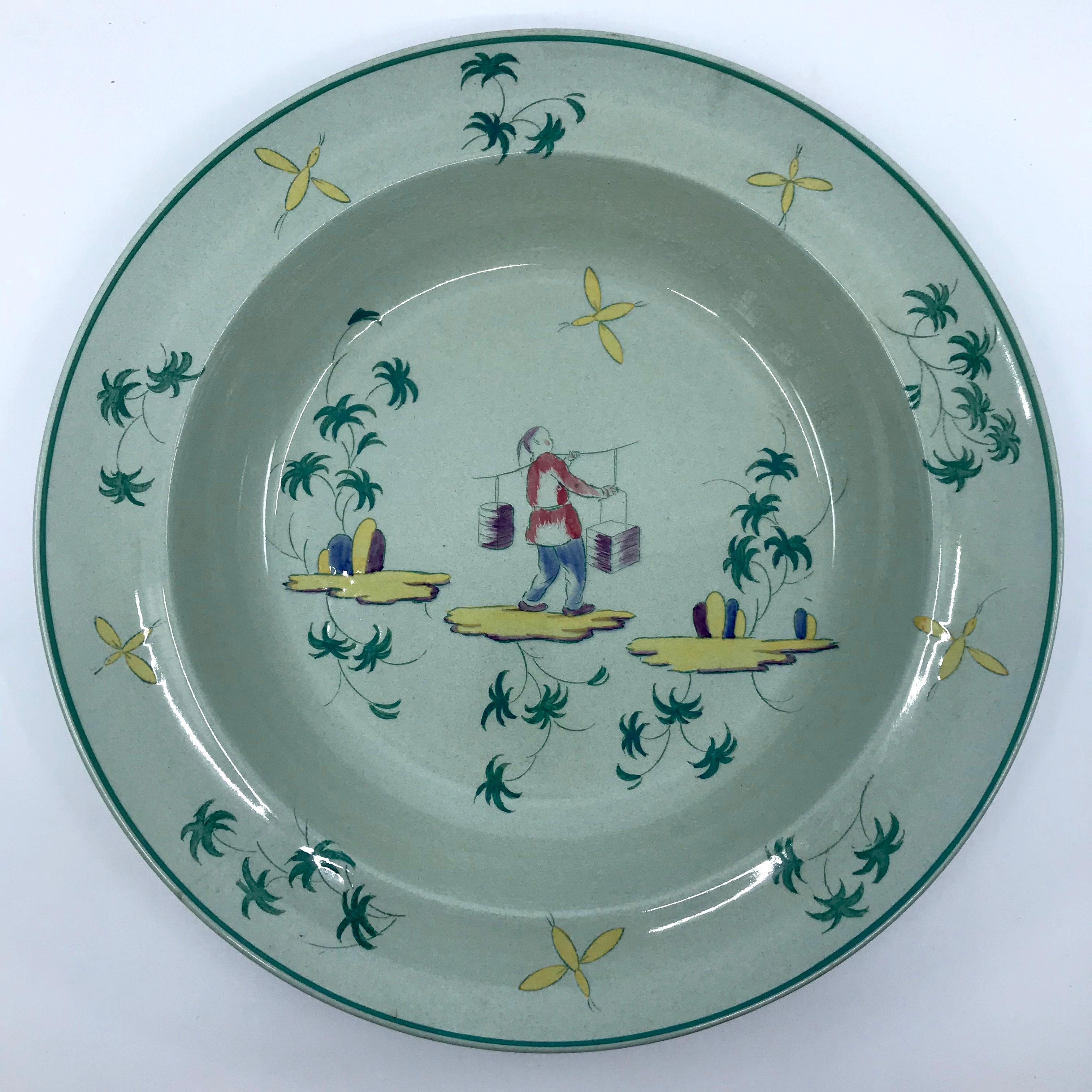 Wedgwood Apprey celadon place-setting plates. Set of three pale celadon pieces for a single place-setting in the rare and charming chinoiserie pattern including a dinner plate, luncheon plate and shallow soup bowl featuring water carriers and a