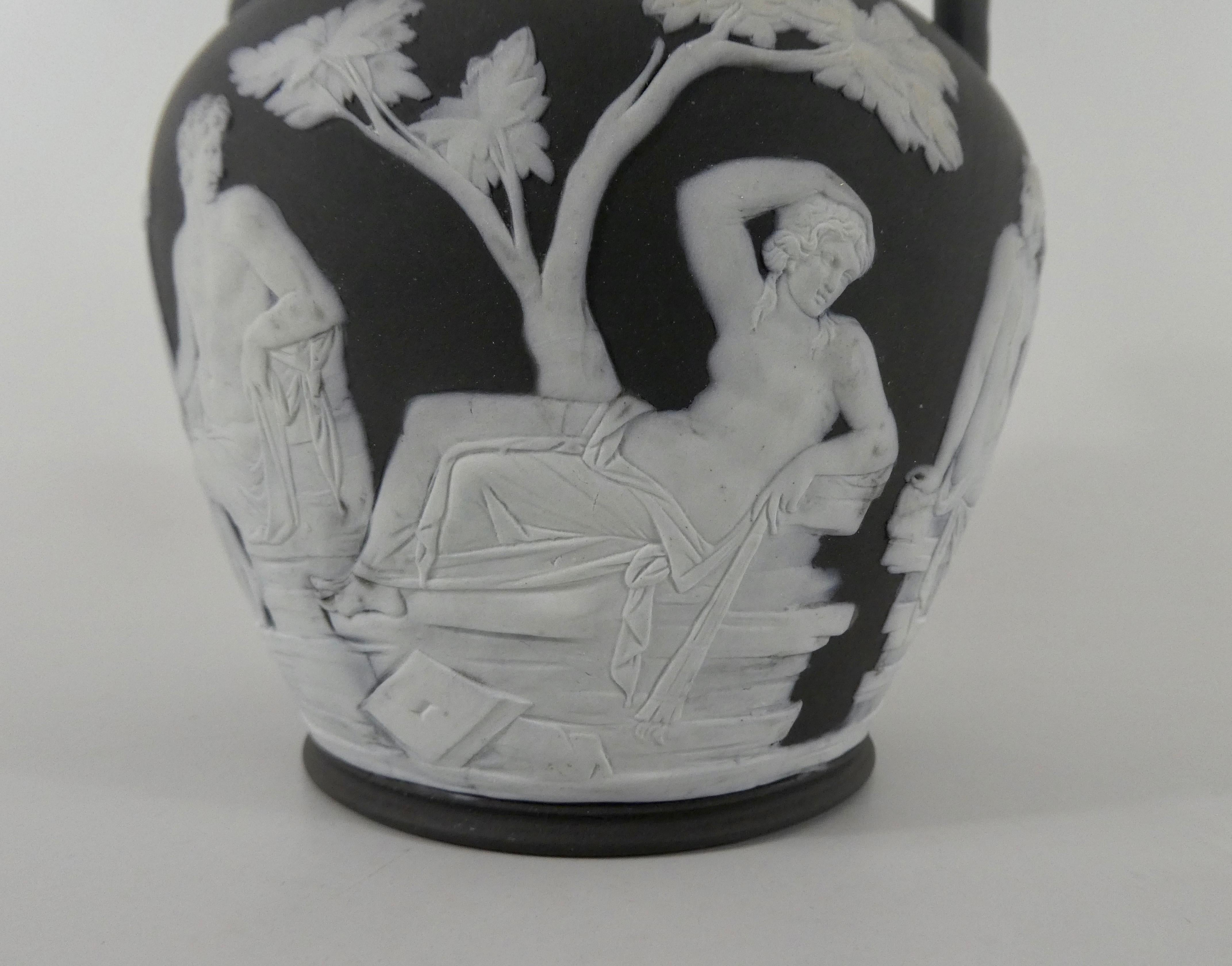 Wedgwood black basalt and white jasper relief vase, circa 1850. Modelled after the Portland Vase, the black solid jasper ground applied with white reliefs depicting the myth of Peleus and Thetis.
Impressed ‘Wedgwood’, to the base.
Height - 17 cm,