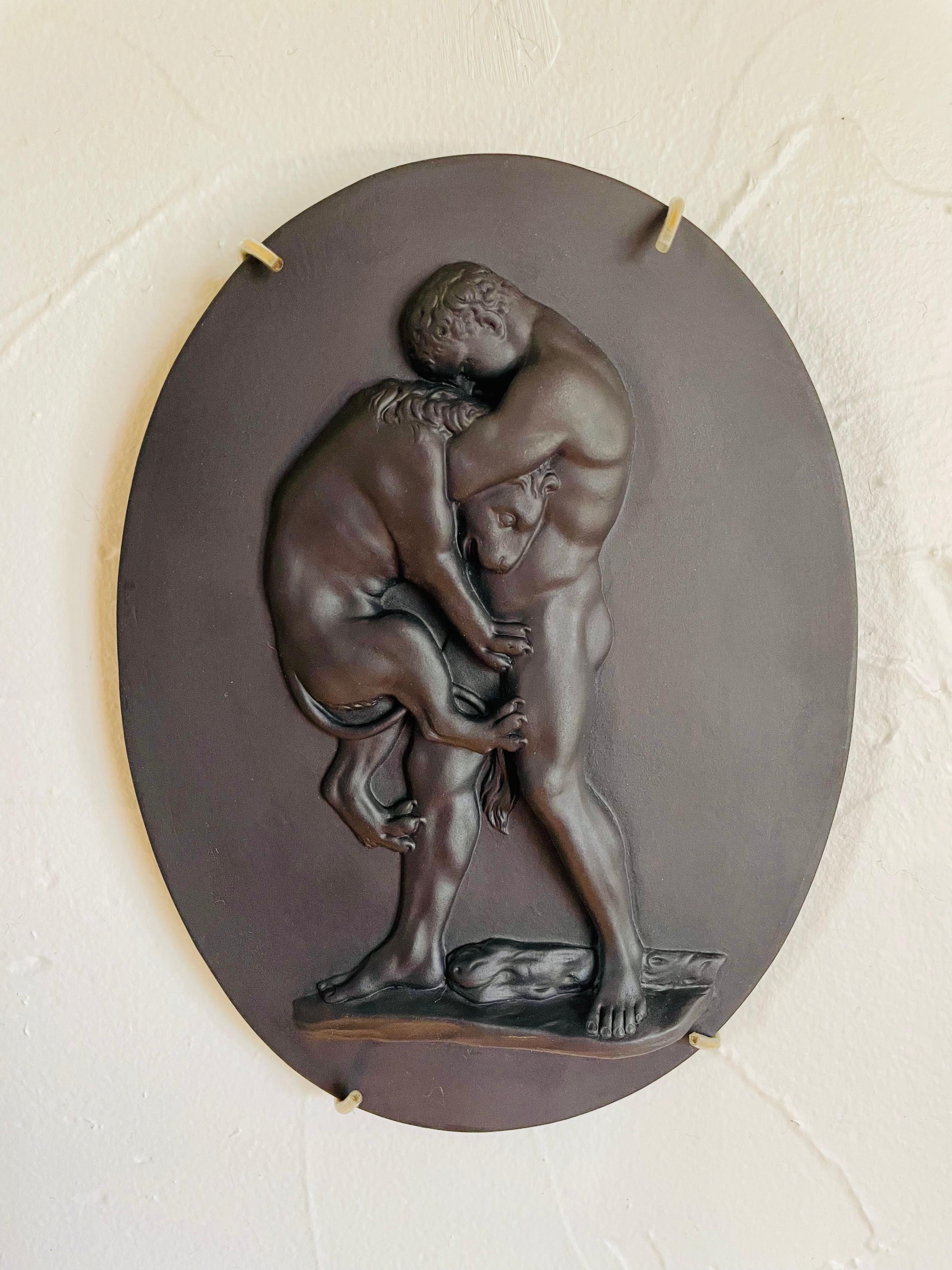 Etruria, Staffordshire, 1910-1930, depicting Hercules hugging a struggling lion by its neck, fine undercutting detail, especially at toes, impressed 