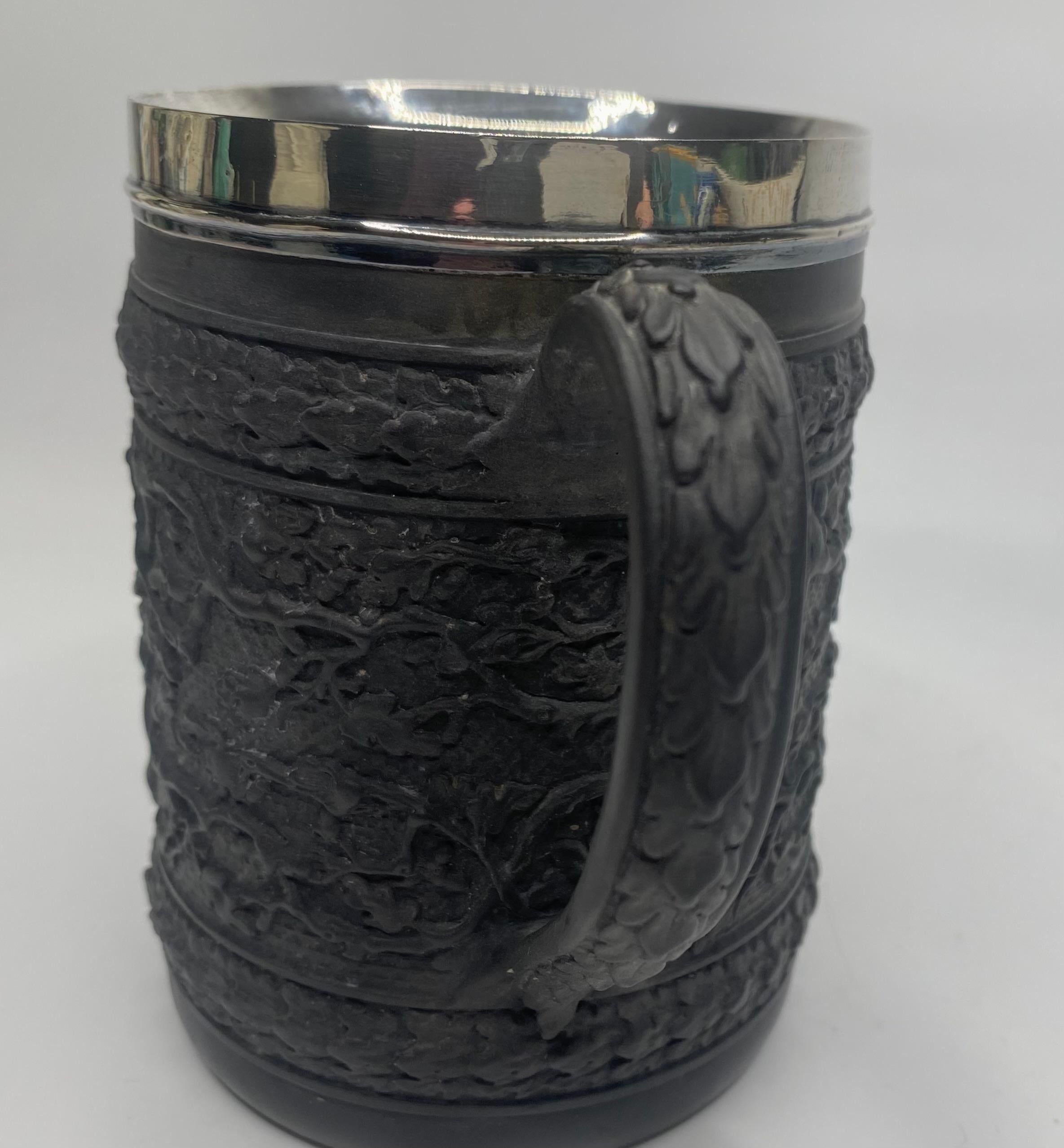 Fired Wedgwood black basalt mug, silver mounted, 1808.