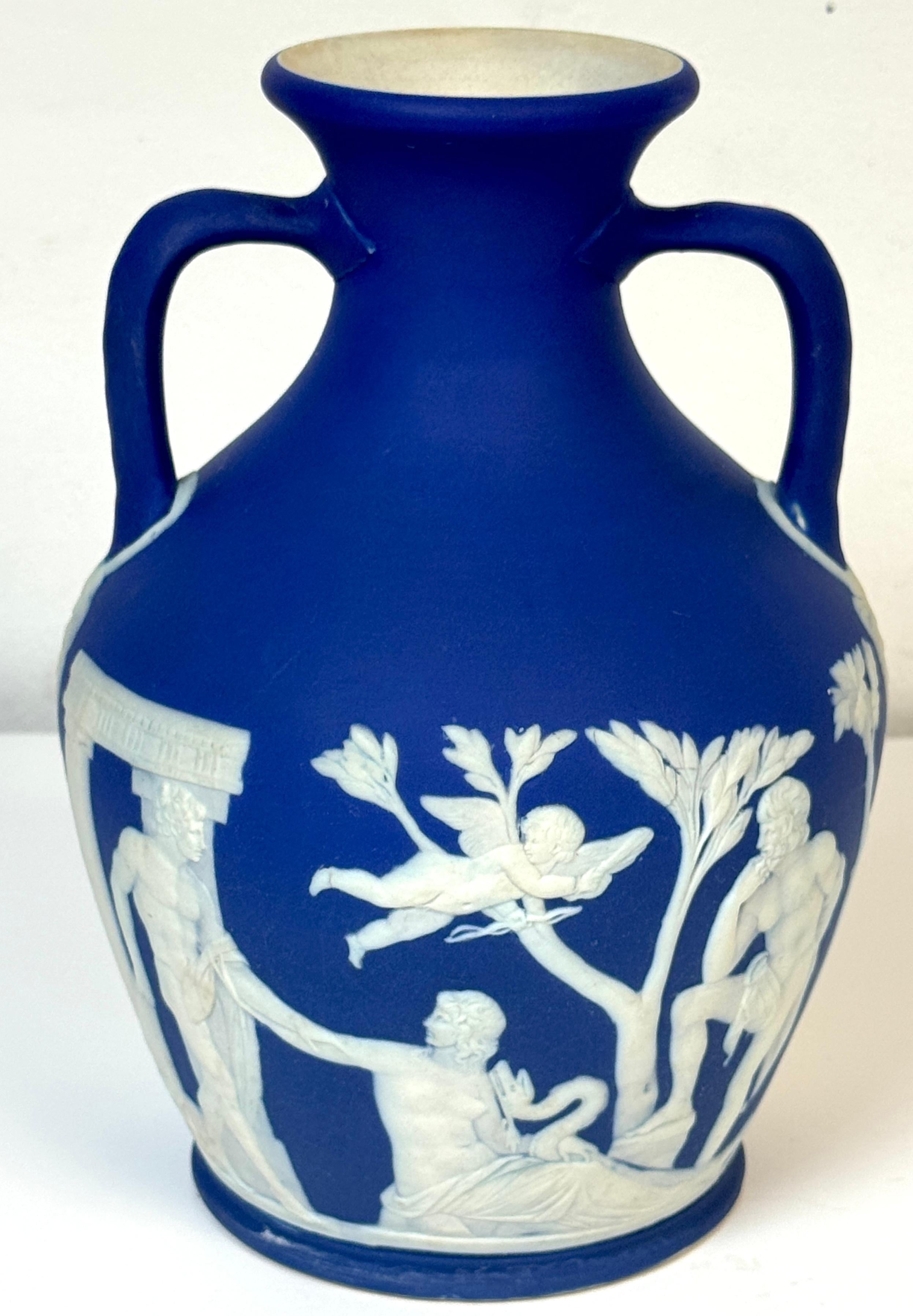 Wedgwood Blue Jasperware Portland Vase, c. 1891–1900

A fine late 19th-century Wedgwood blue jasperware Portland Vase, decorated in white relief on a rich cobalt ground. Inspired by the ancient Roman glass masterpiece in the British Museum, Josiah