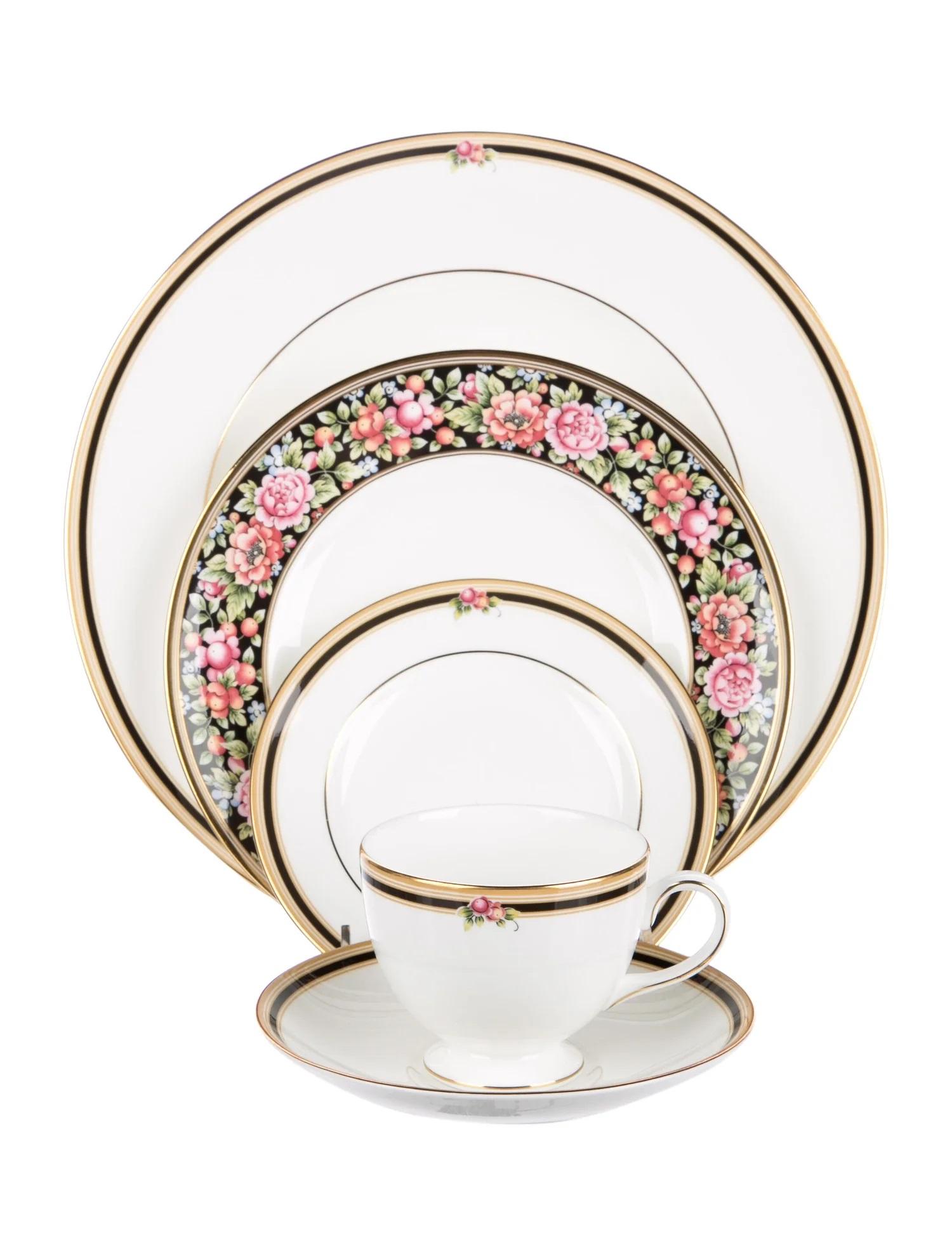 A set of 16 place settings (a total of 80 pieces) in the Clio pattern by Wedgwood.

Features colors of bone, black and gold with floral motif at rims, gilt trim throughout and brand stamp at undersides. 

Made in England; circa 1990. Out if
