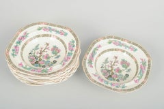 Wedgwood & Co, England. Set of 8 faience deep plates with oriental motif.