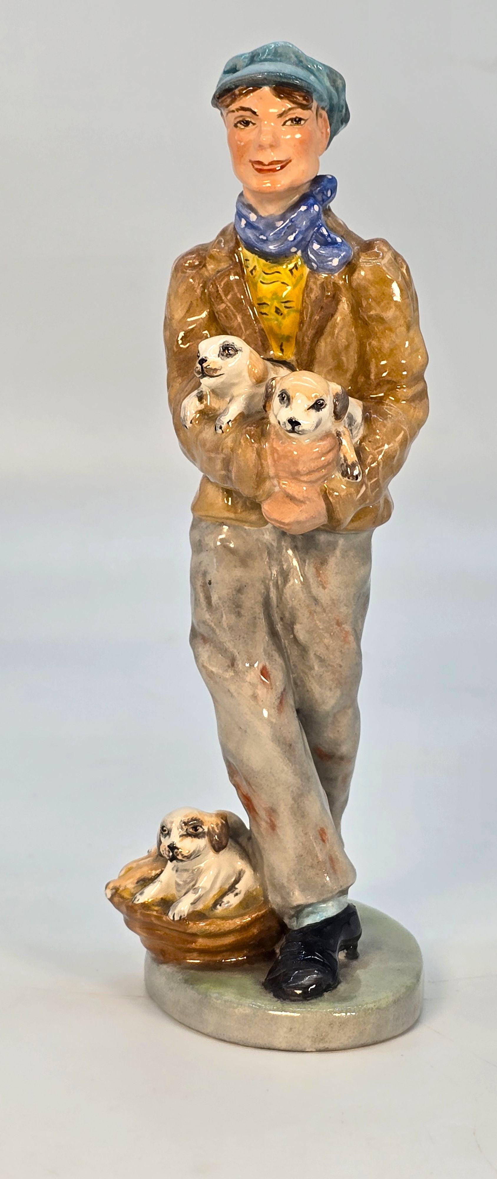 Edoardiano Wedgwood & Co. Ltd China figura del venditore di cuccioli, inglese, circa 1910 in vendita