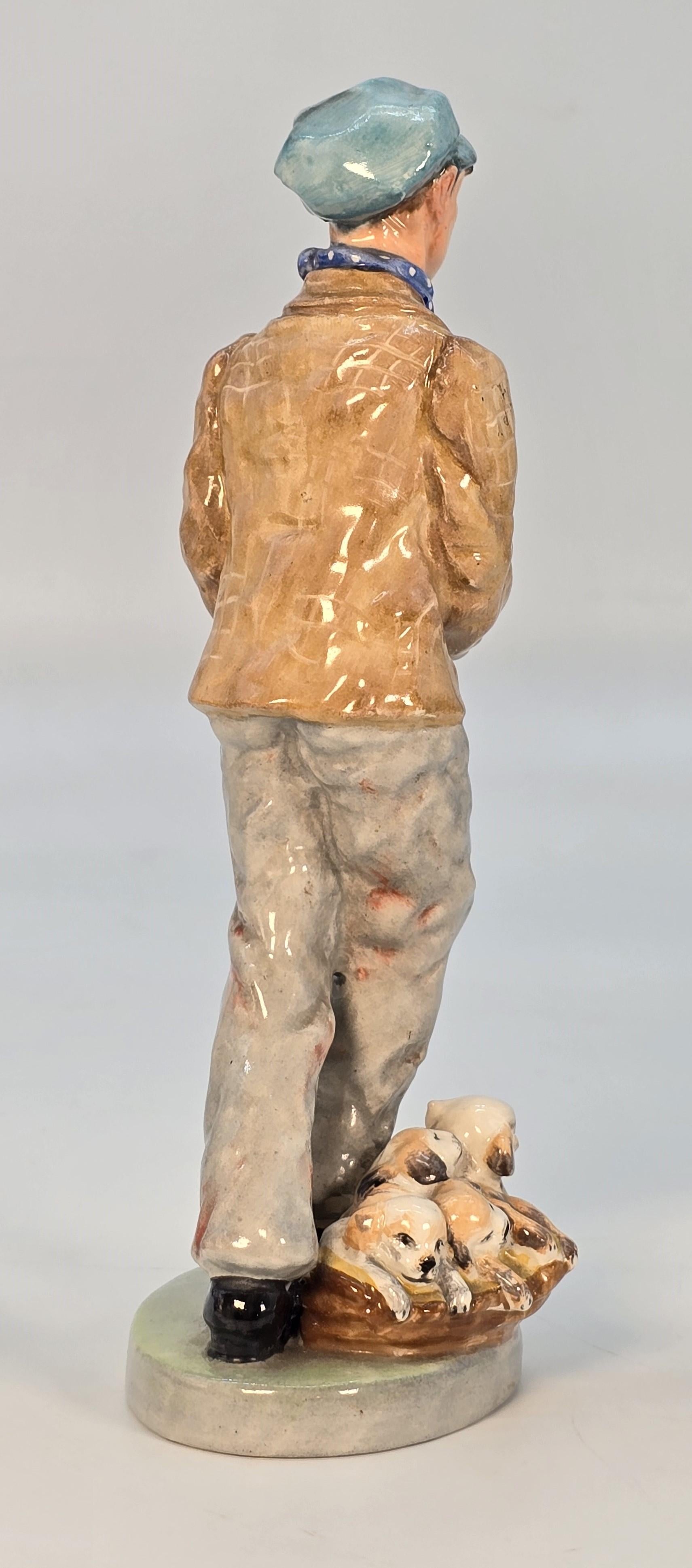 XX secolo Wedgwood & Co. Ltd China figura del venditore di cuccioli, inglese, circa 1910 in vendita