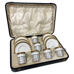 Antique Wedgwood coffee cups and saucers with silver cup holders by Walker & Hall, 1919