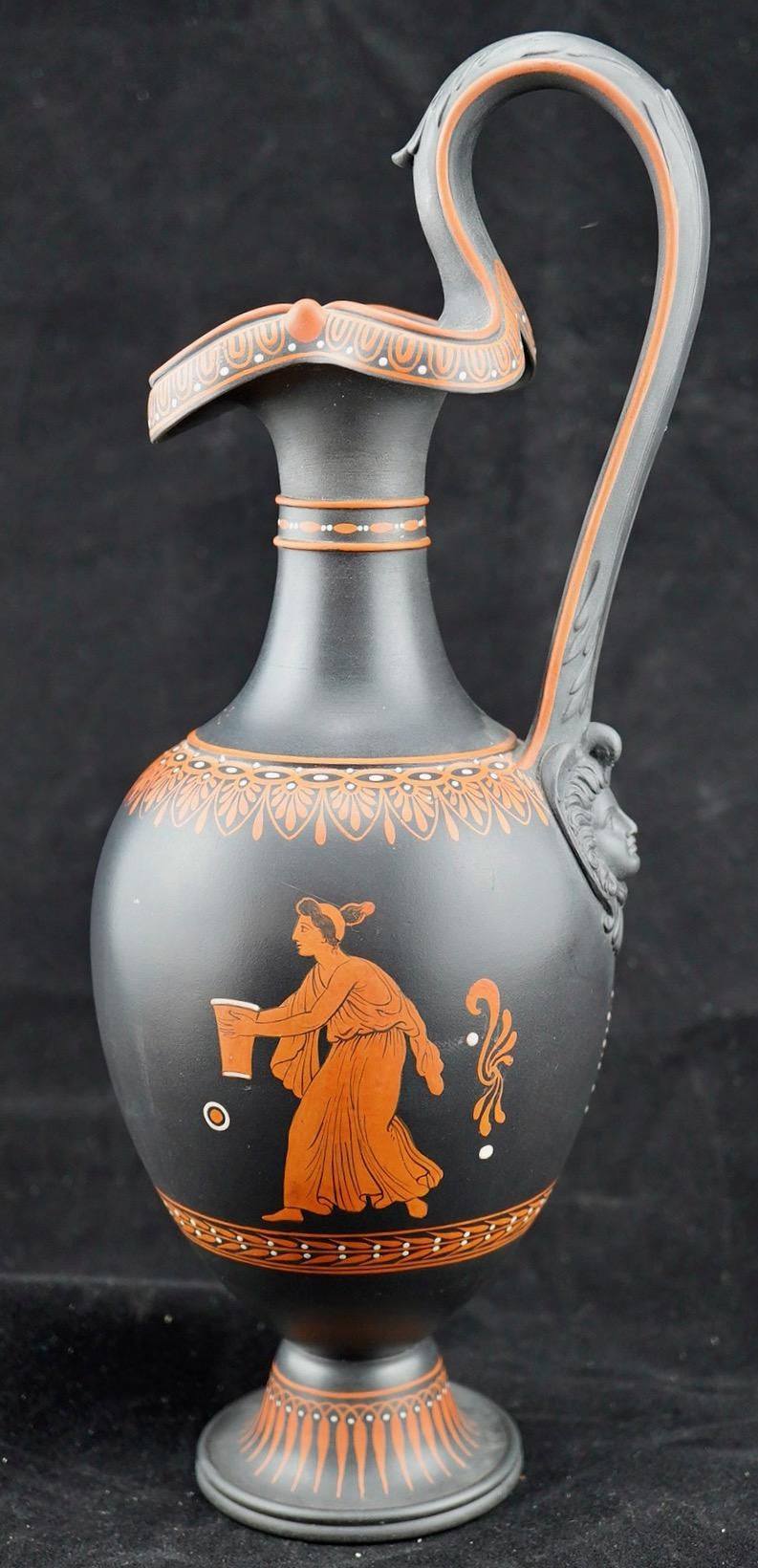 Wedgwood basalt encaustic ewer with ancient Greek inspired decoration on both sides. The shape is also inspired by a Greek wine jug, known as oenochoe. Fine detail and excellent condition.